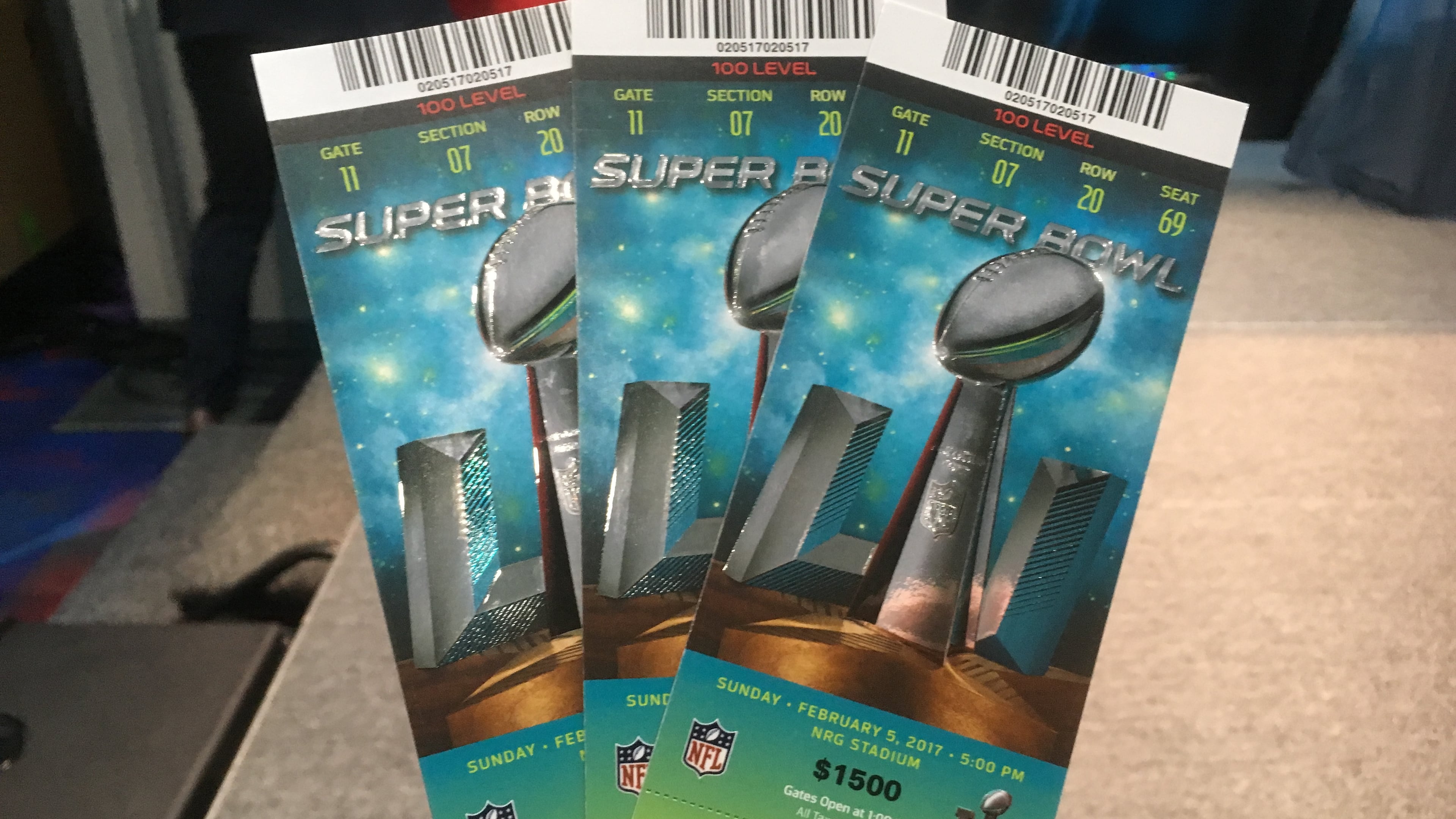 Real tickets have a number of security measures, including raised surfaces, holograms and other elements. No matter how real the fake ones look, they won't get you into the game, officials warn. Photo: Jennifer Brett