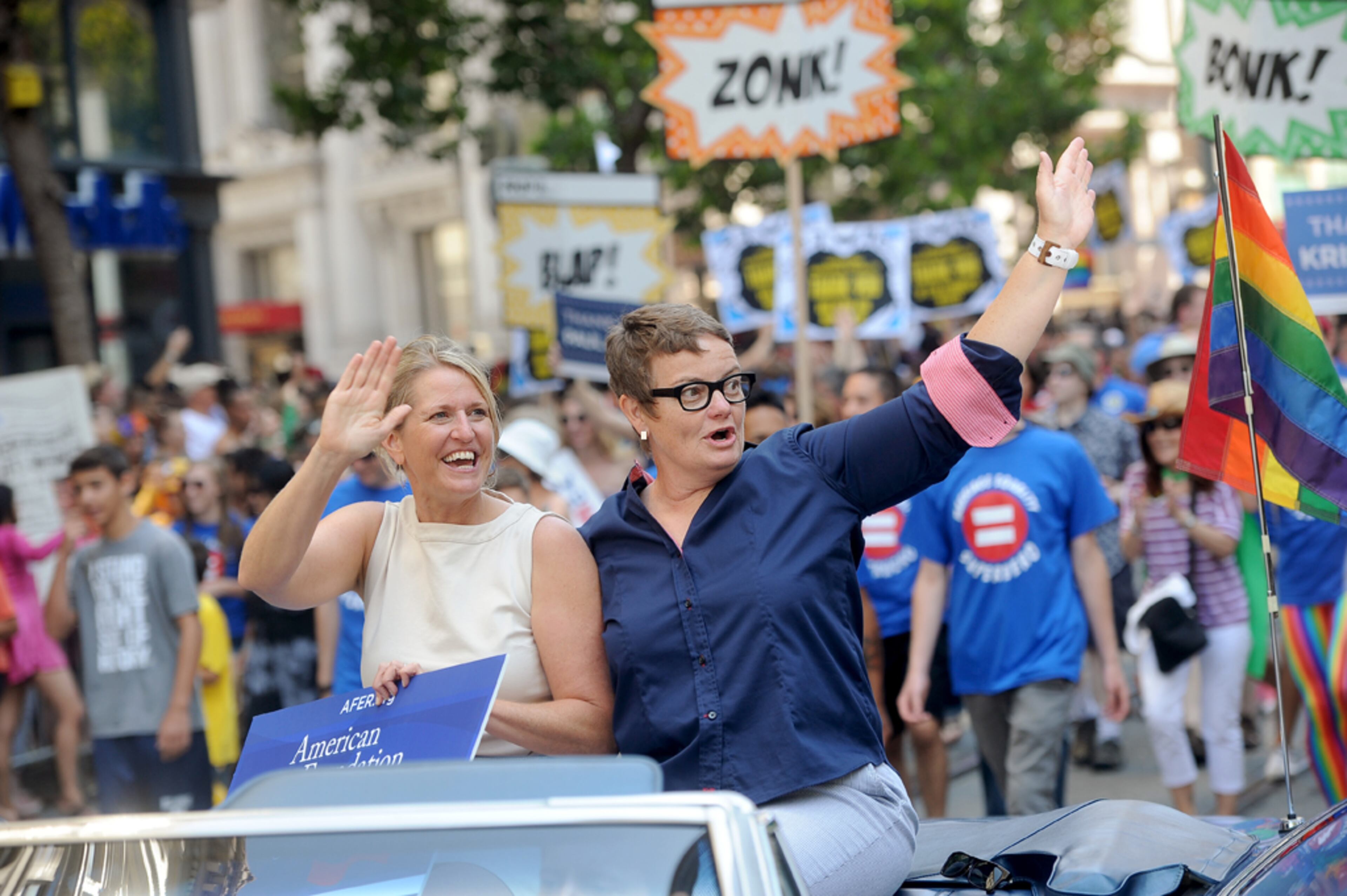 Proposition 8 plaintiffs Kris Perry, left, and Sandy Steir ride in San Francisco's 43rd annual gay pride parade Sunday, June 30, 2013. The couple wed on Friday after a U.S. Supreme Court decision cleared the way for same-sex marriages in California. (AP Photo/Noah Berger)