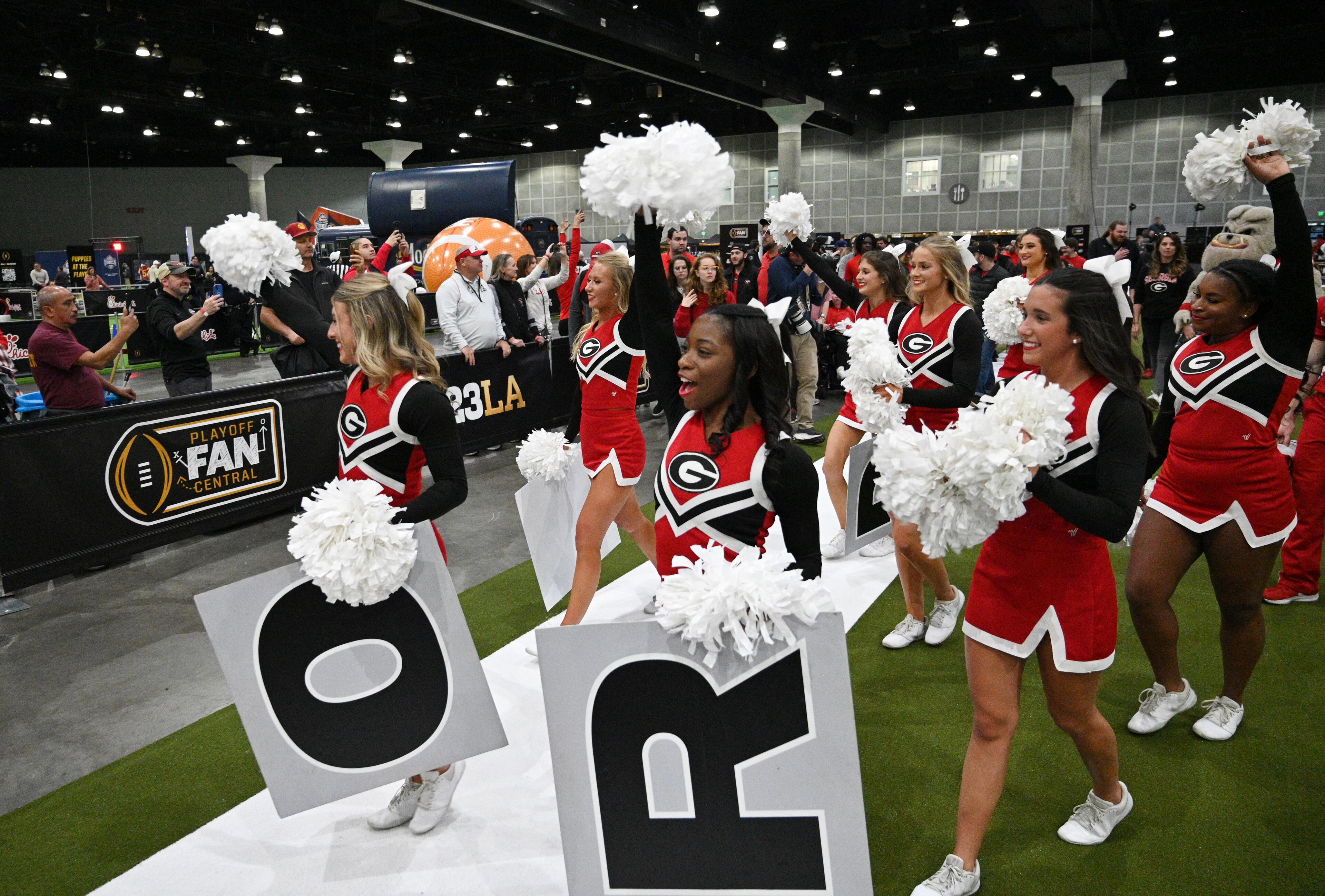 Georgia cheerleaders leave during a pep rally at the Playoff Fan Central at the LA Convention Center, Sunday, Jan. 8, 2023, in Los Angeles. (Hyosub Shin / Hyosub.Shin@ajc.com)