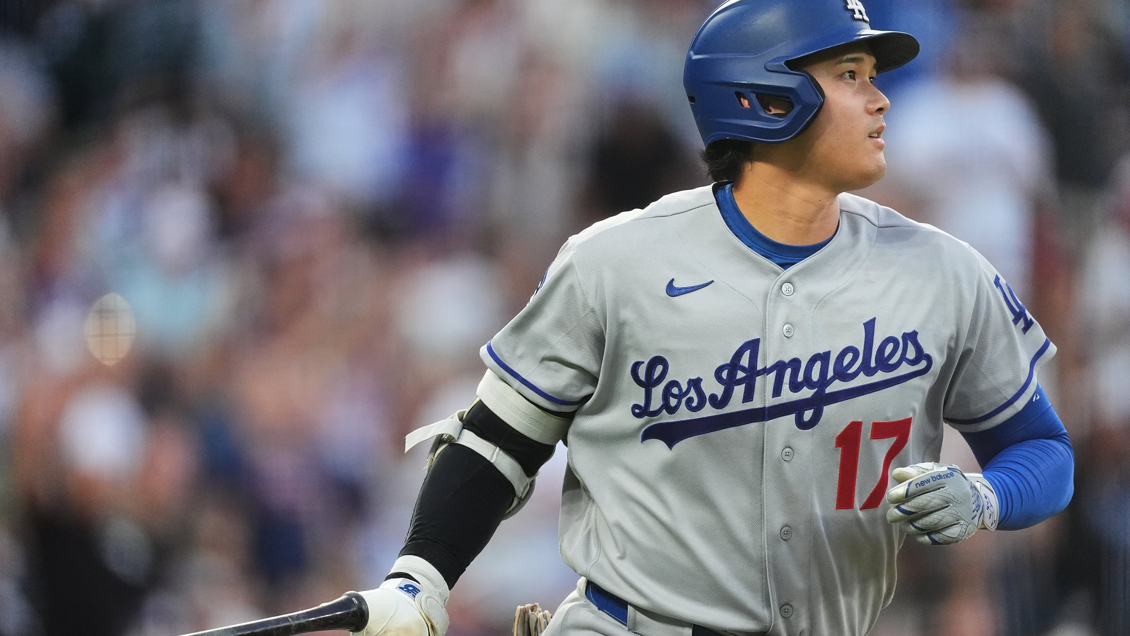 Los Angeles Dodgers' Shohei Ohtani drops his bat as he heads up the first-base line after hitting a two-run home run off Colorado Rockies starting pitcher Ryan Feltner in the third inning of a baseball game Tuesday, Aug. 18, 2026, in Denver. (AP Photo/David Zalubowski)