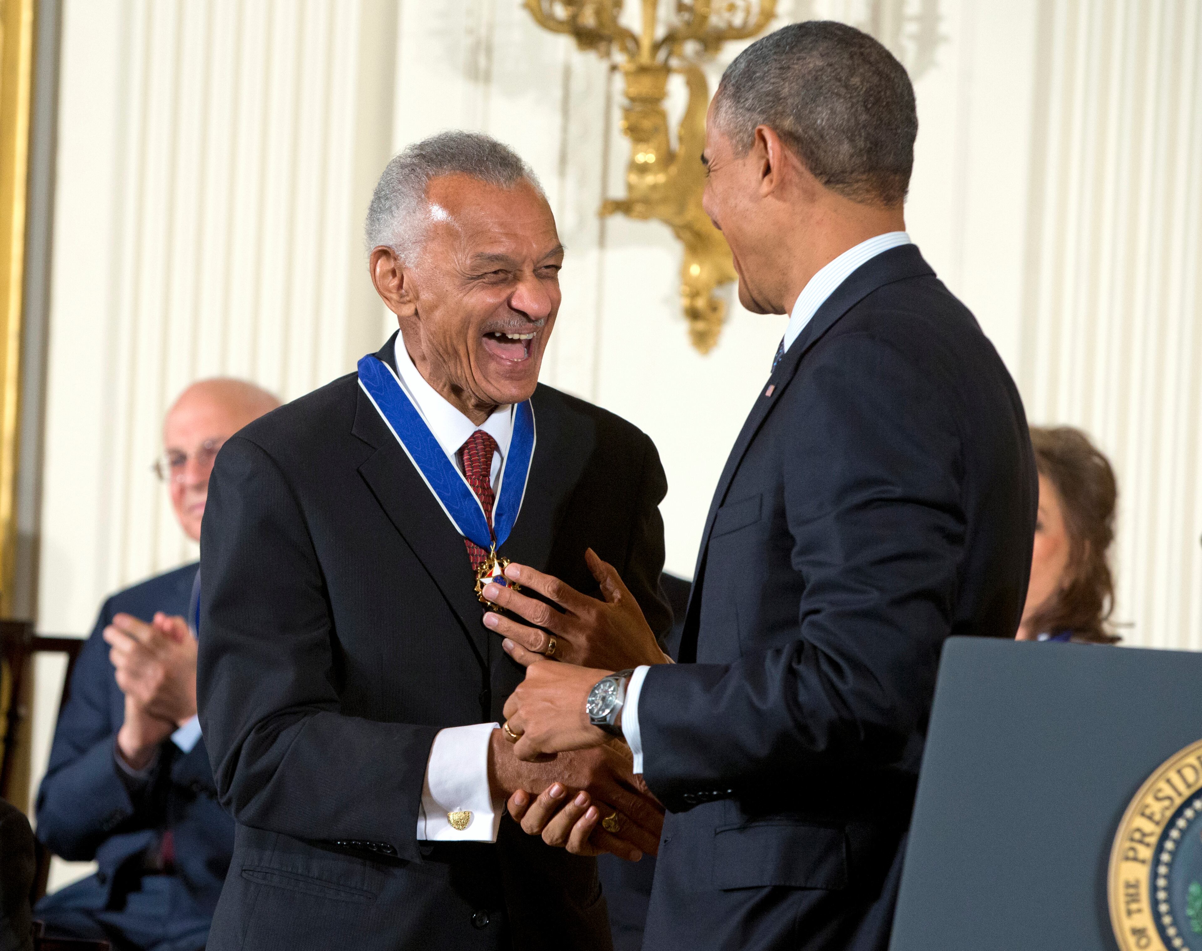 Civil rights activist Cordy Tindell "C.T." Vivian laughs with President Barack Obama after the president awarded him with the Presidential Medal of Freedom, Wednesday, Nov. 20, 2013, during a ceremony in the East Room of the White House in Washington. (AP Photo/ Evan Vucci)