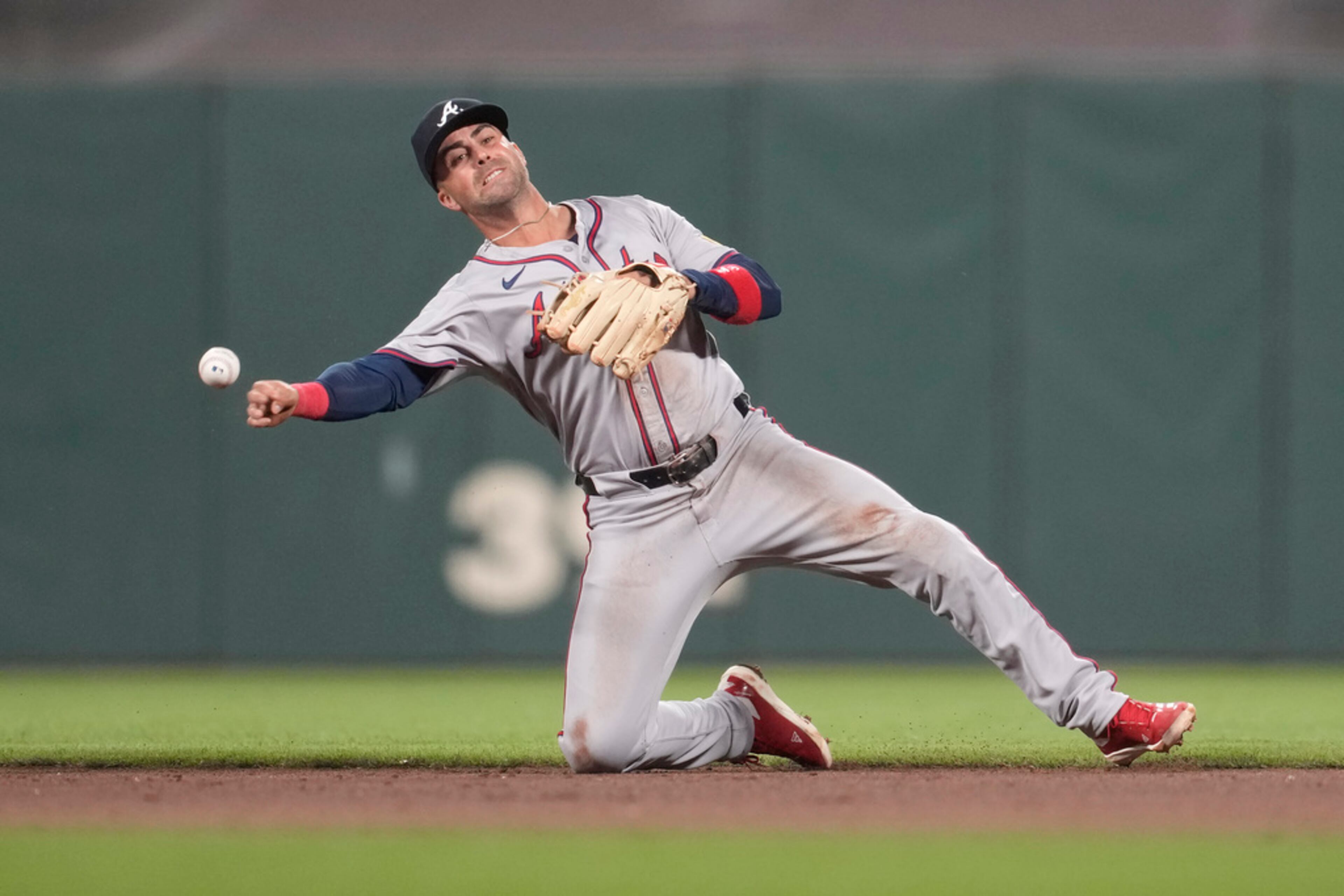 Atlanta Braves second baseman Whit Merrifield throws out San Francisco Giants' Patrick Bailey at first base during the sixth inning of a baseball game in San Francisco, Tuesday, Aug. 13, 2024. (AP Photo/Jeff Chiu)