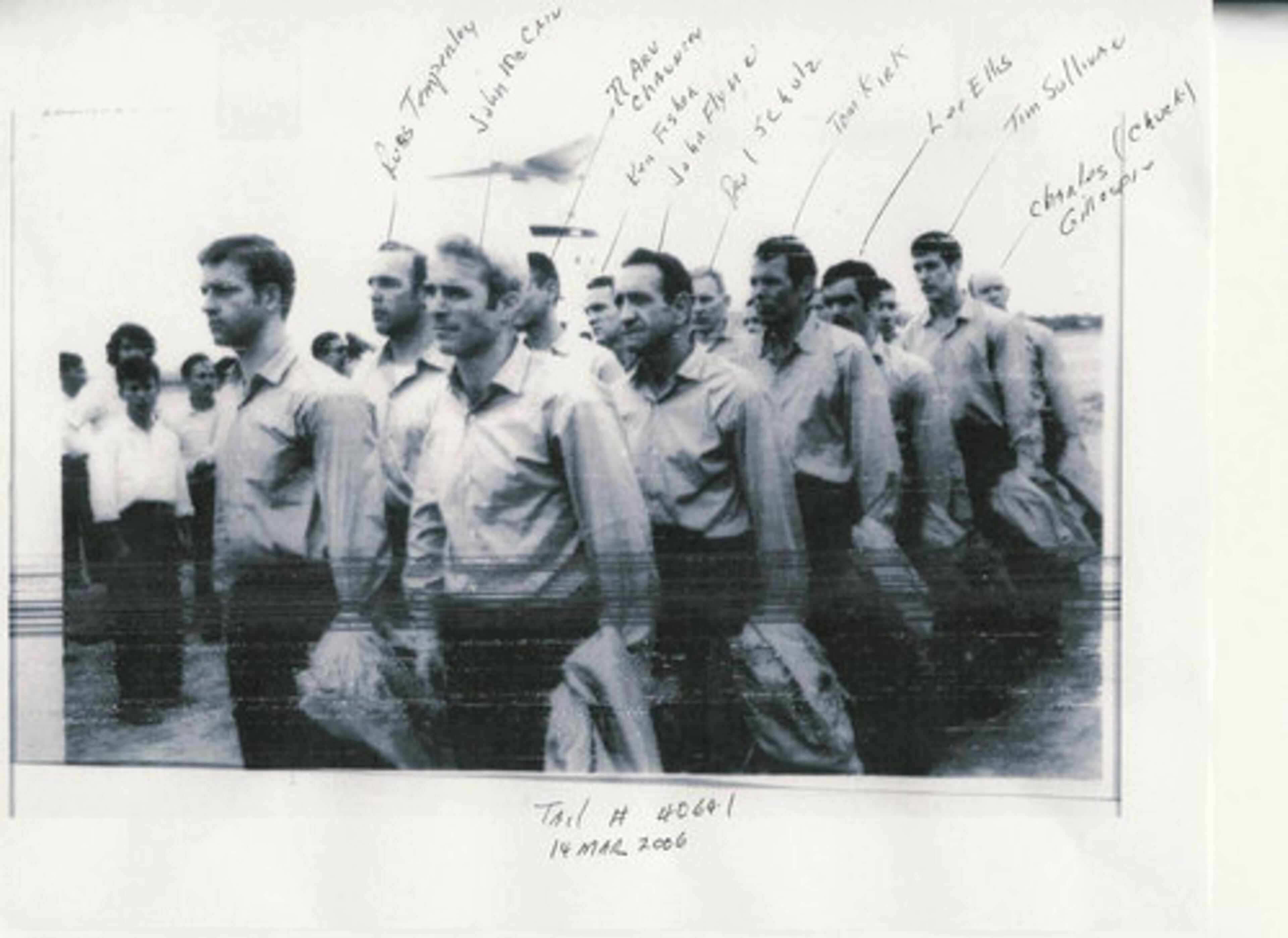 After the Paris Peace Accords, the prisoners were informed they would be released. This Department of Defense photo shows them on their return to the U.S. At the front left is John McCain, Lee Ellis is the fourth person behind him.