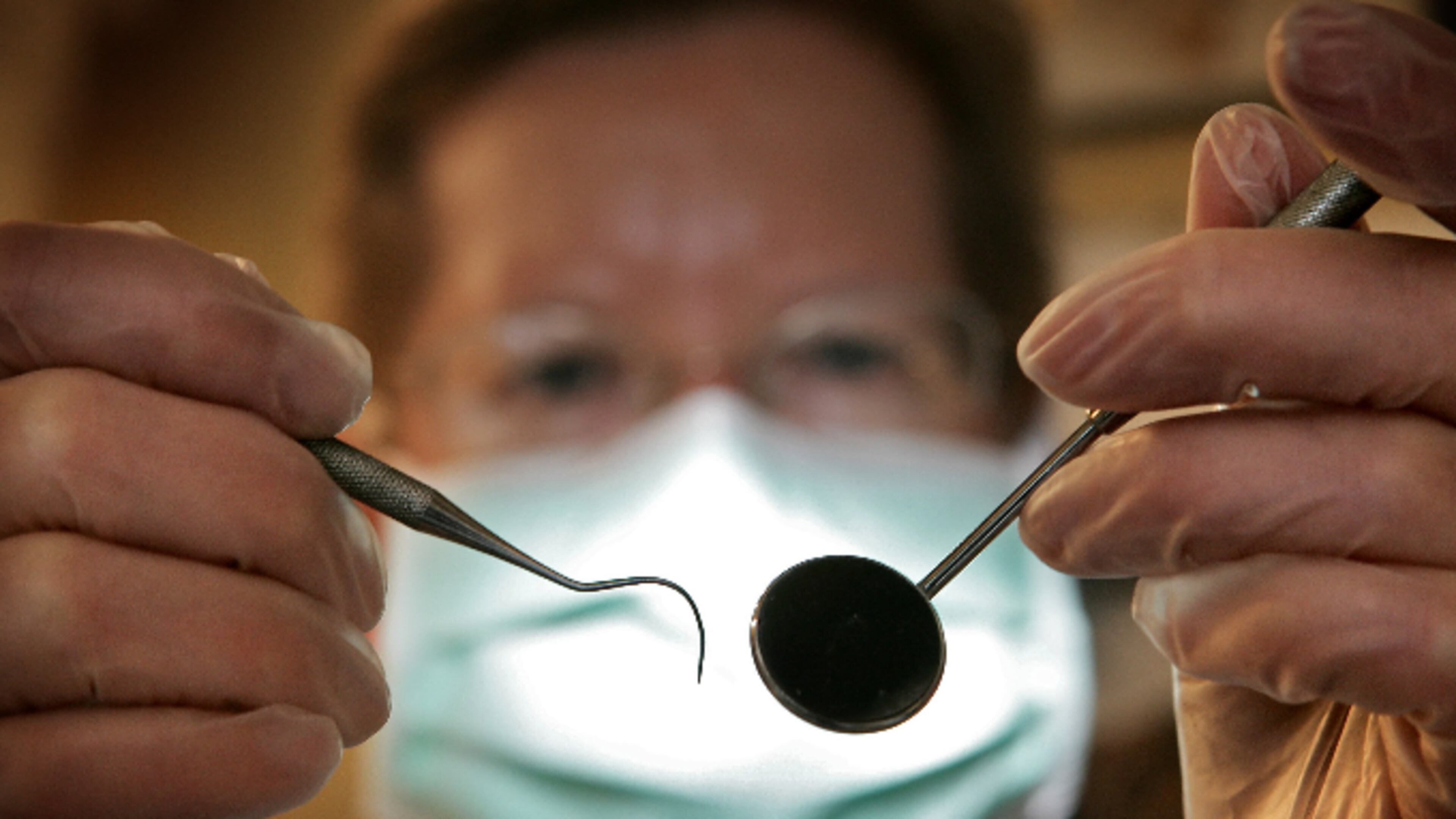 GREAT BOOKHAM, UNITED KINGDOM - APRIL 19: A patient's eye view, as a dentist poses for the photographer on April 19, 2006 in Great Bookham, England. (Photo by Peter Macdiarmid/Getty Images)