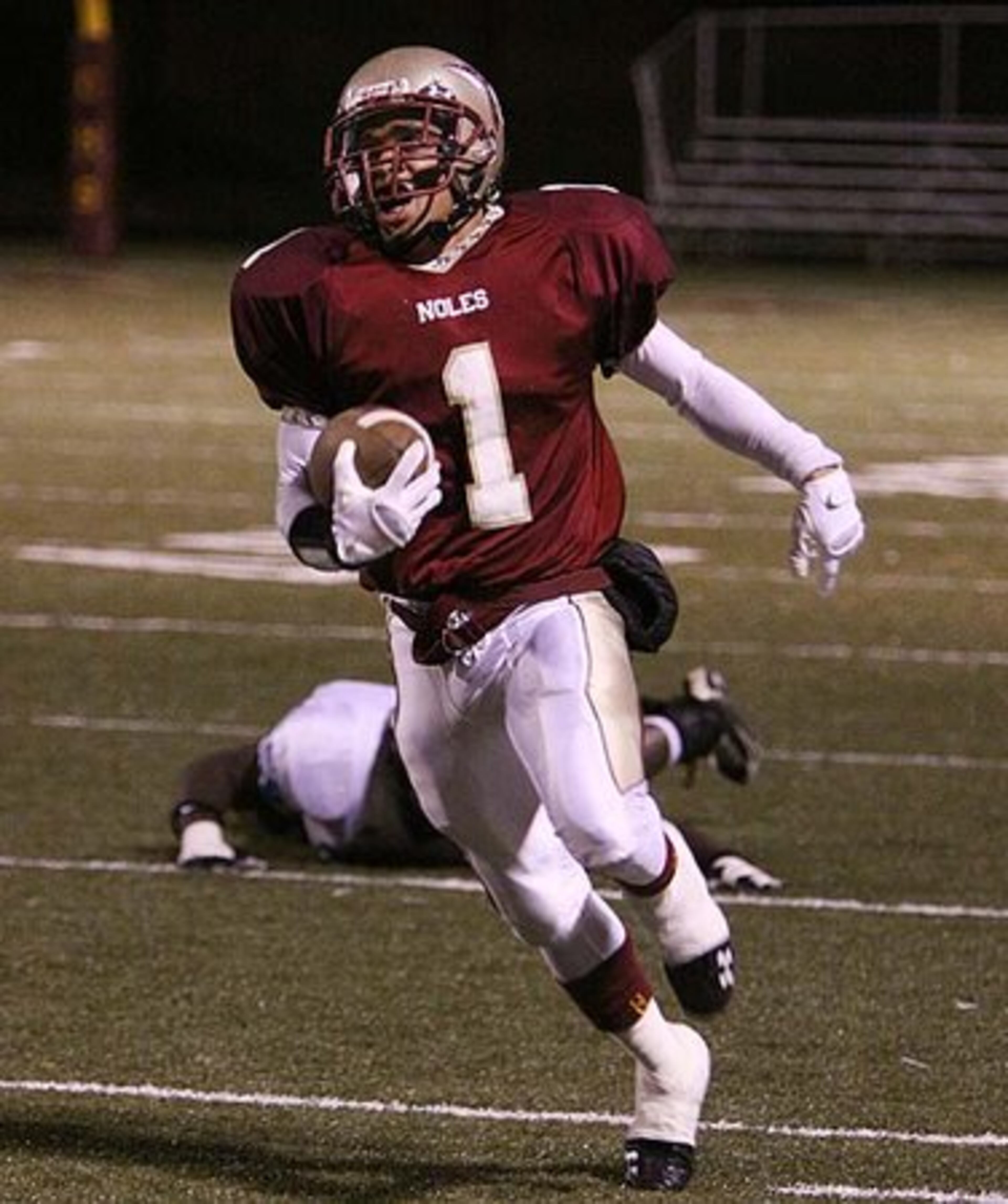Wide receiver Deaires Driskell gasps for breath as he runs the final five yards of a large gain before being forced out of bounds. Driskell successfully evaded nearly the whole Lovejoy team before reversing directions to make his way downfield.