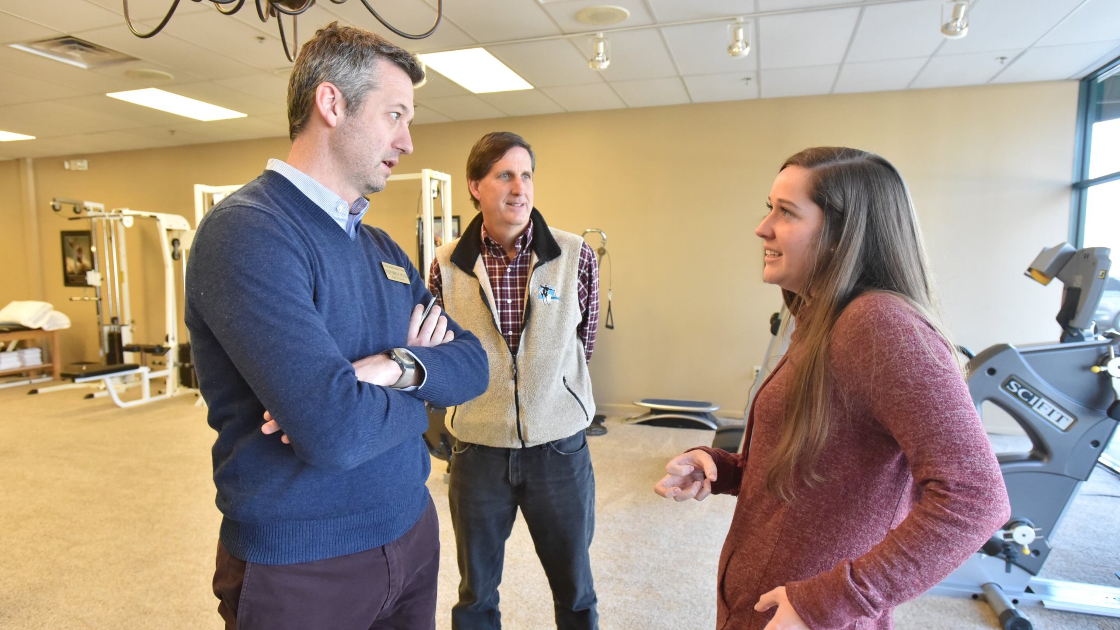 Caroline Freemeyer consults physical therapist Steven Owens (left) as her father, Jeff Freemeyer, looks on. Jeff Freemeyer did everything he was supposed to do in looking for his family’s 2018 health insurance policy, making sure their doctors and facilities were in network. Then as soon as the new year turned and Caroline needed her long-term doctor, it turned out they actually weren’t. Georgians on the individual health insurance market, both Affordable Care Act exchanges and not, are seeing changes that amount to a wholesale shift. HYOSUB SHIN / HSHIN@AJC.COM