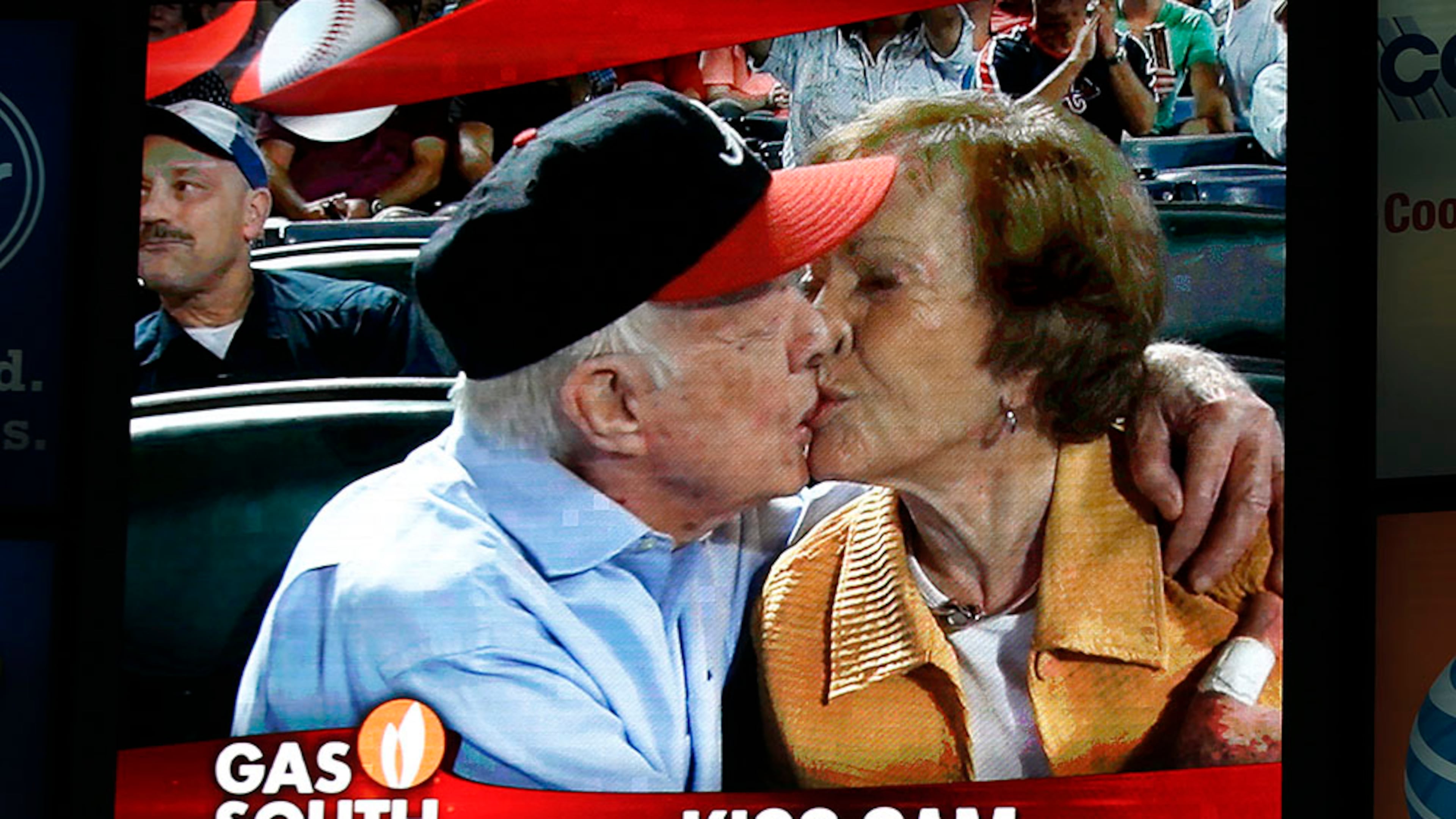 2015: Jimmy Carter kisses Rosalynn on the "Kiss Cam" during a baseball game between the Atlanta Braves and the Toronto Blue Jays in Atlanta. Carter had recently announced his cancer diagnosis. (John Bazemore / AP)
