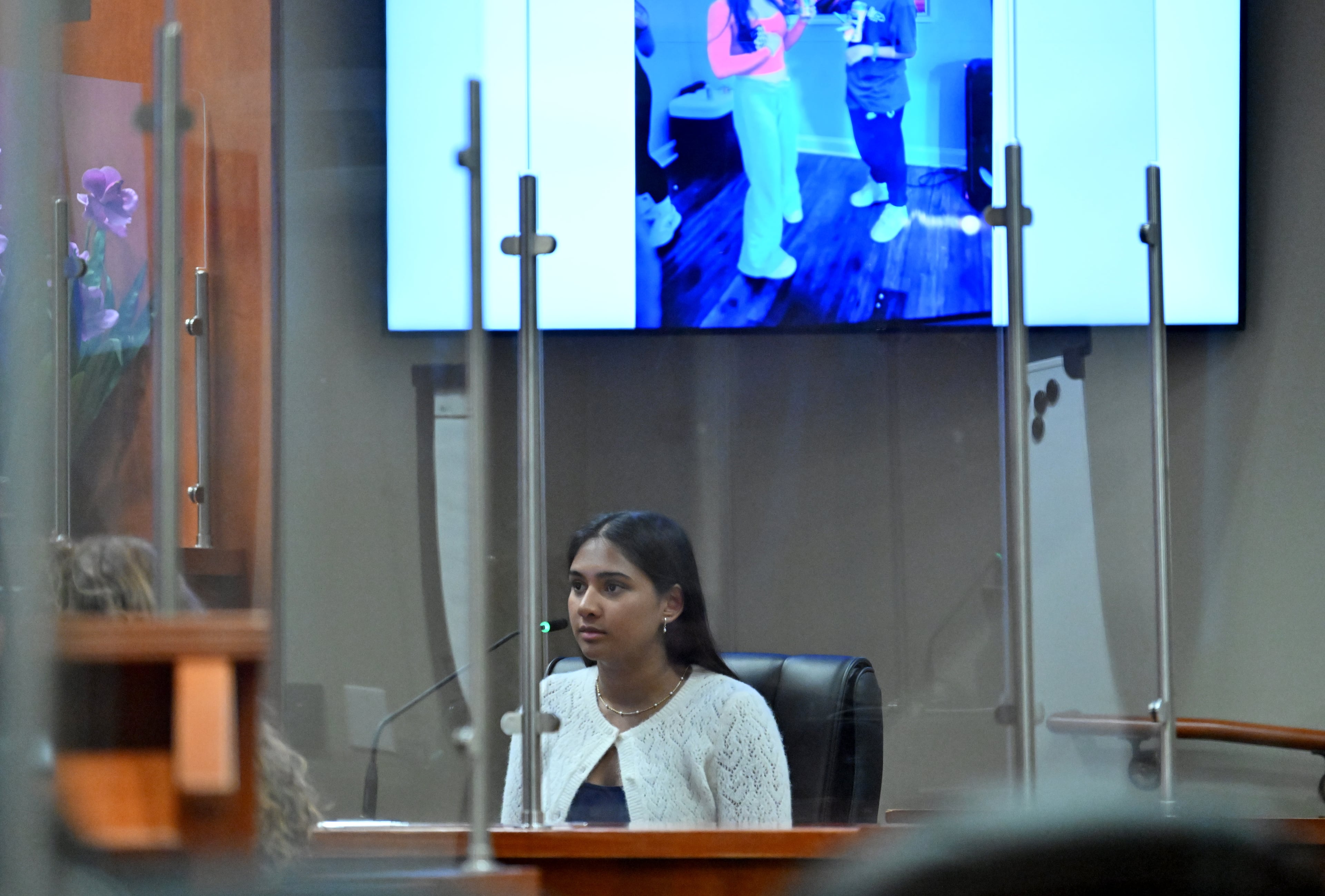 Ananya Rao, daughter of Sumanth and Anindita Rao, testifies on the witness stand during a hearing at DeKalb County Courthouse in April 2026. (Hyosub Shin/AJC)