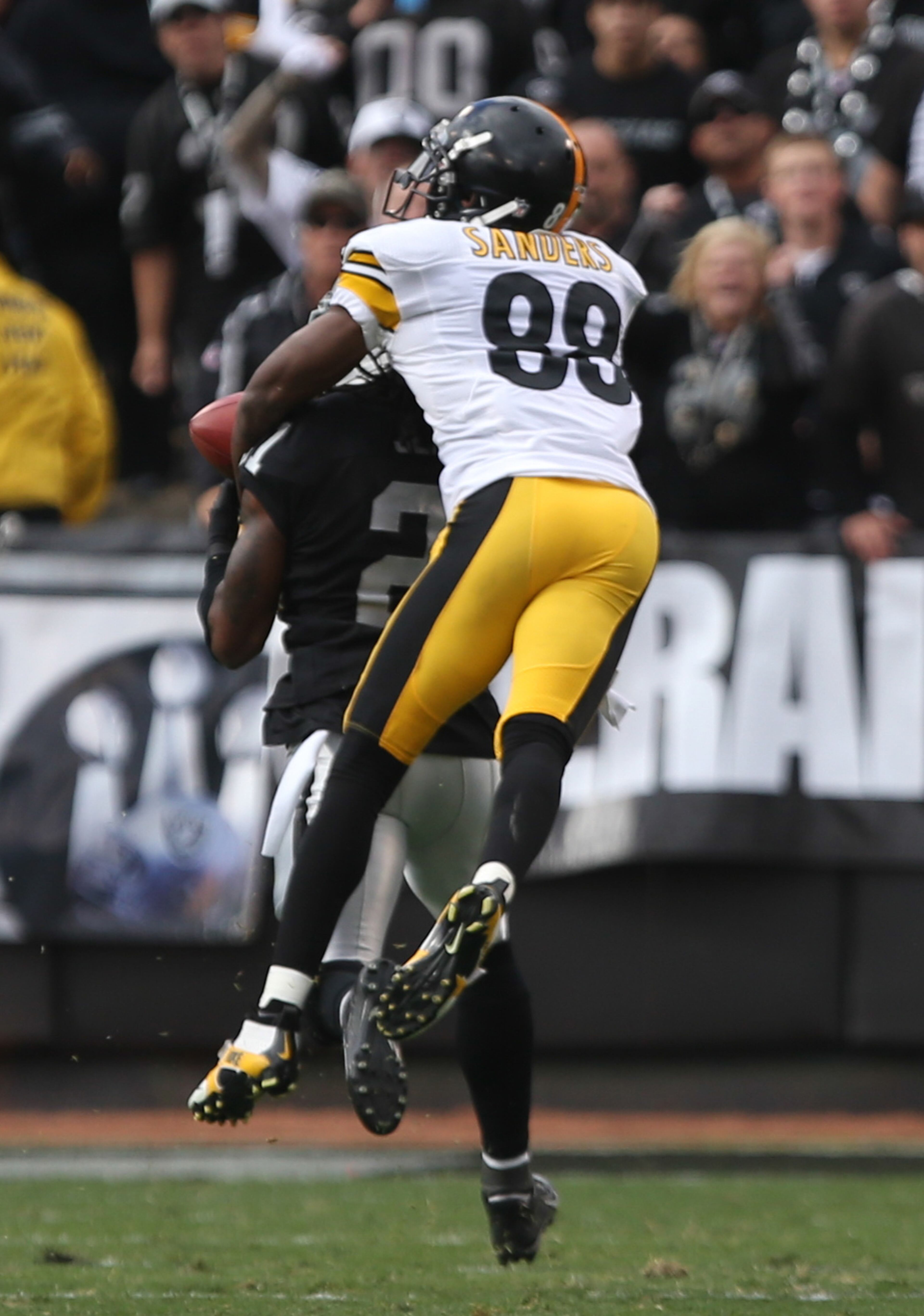 Oakland Raiders cornerback Mike Jenkins (21) intercepts the pass intended for Pittsburgh Steelers wide receiver Emmanuel Sanders (88) during the fourth quarter at O.co Coliseum. The Oakland Raiders defeated the Pittsburgh Steelers 21-18. Mandatory Credit: Kelley L Cox-USA TODAY Sports