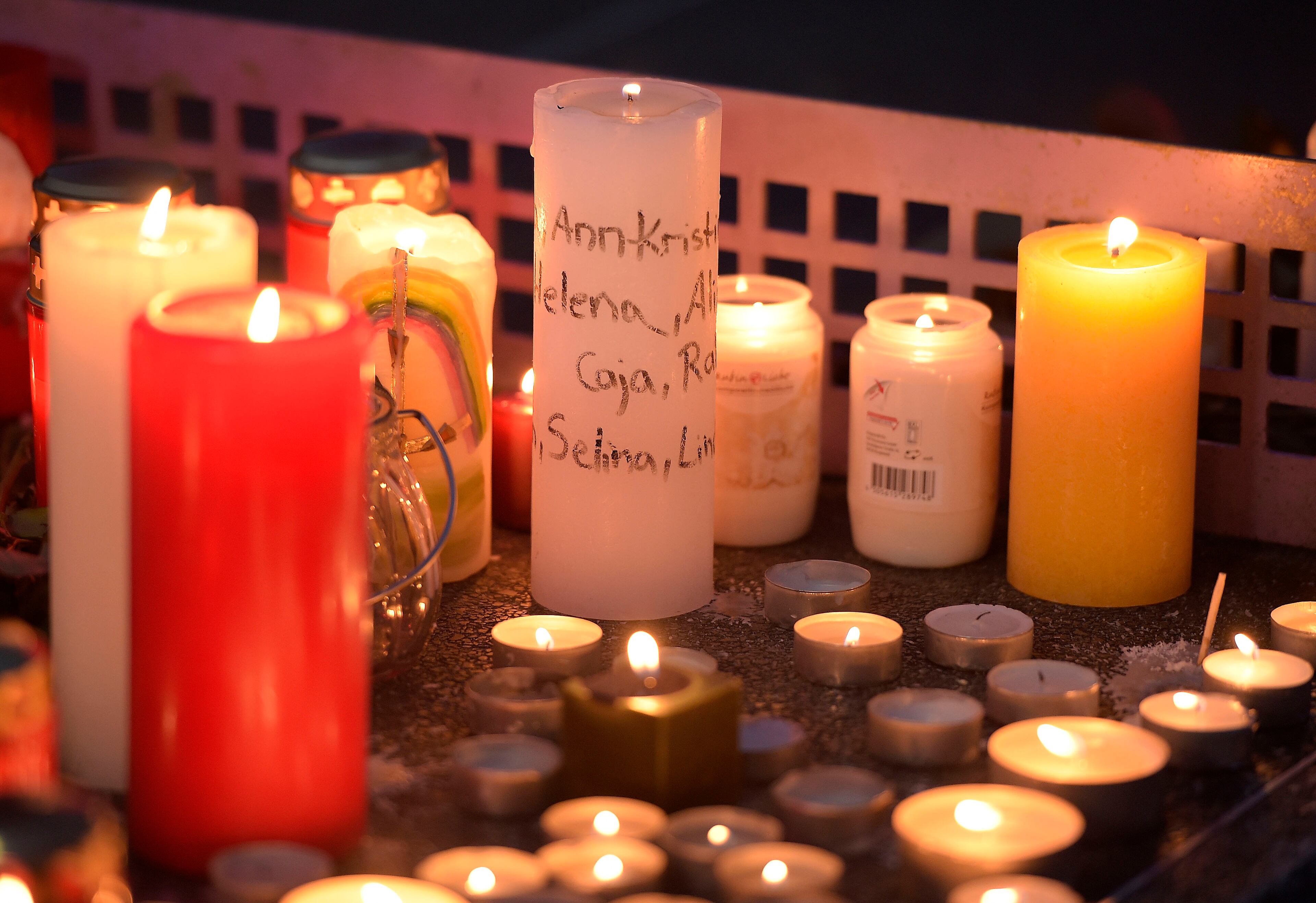 Candles - some with names written on it - sit on a table tennis table in front of the Joseph-Koenig Gymnasium in Haltern, western Germany Tuesday, March 24, 2015. A Germanwings plane from Barcelona crashed on its way to Duesseldorf over the French alps, 16 students and 2 teachers from Haltern were among the 150 people on board. (AP Photo/Martin Meissner)