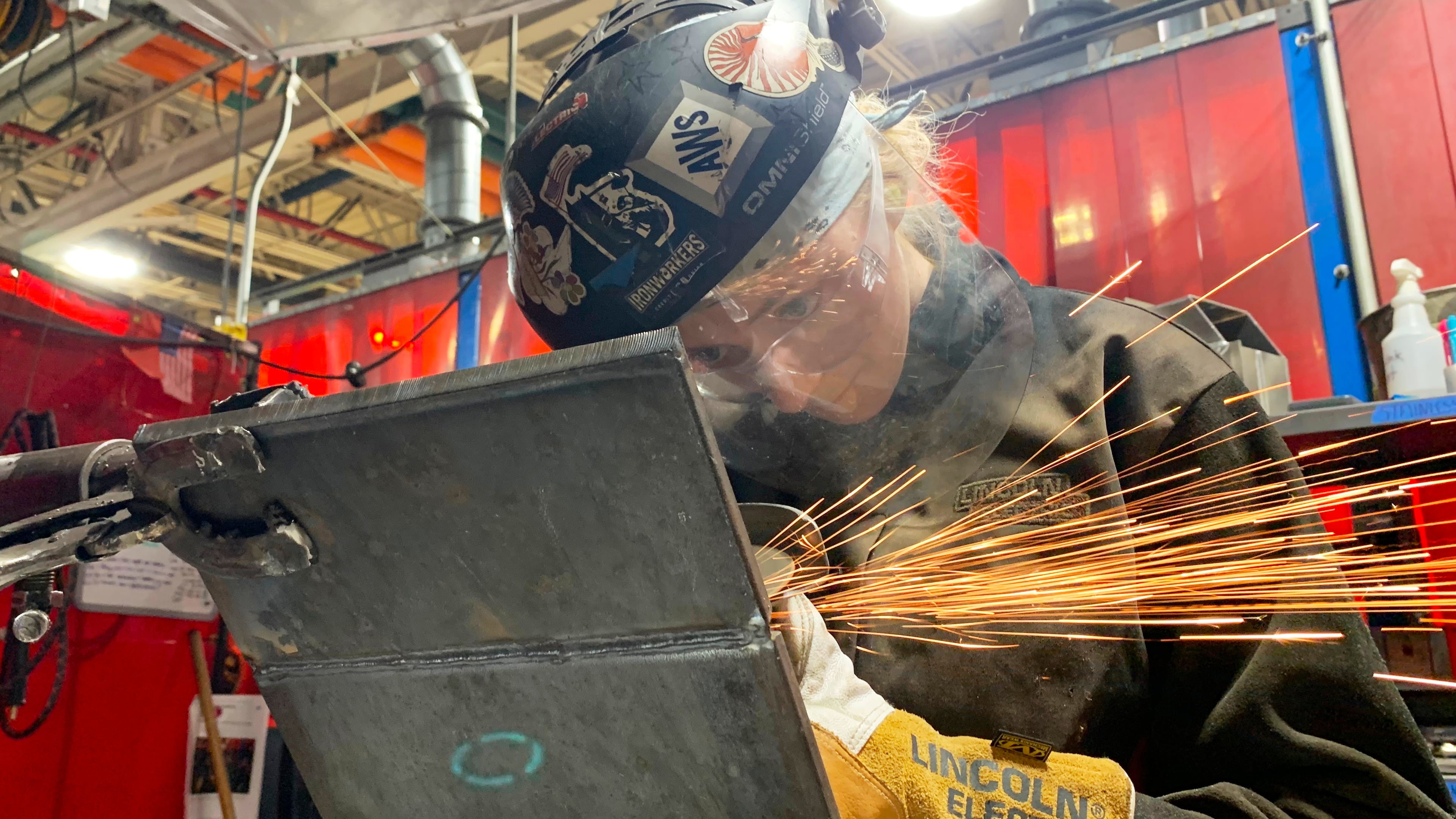 Student Mikala Sposito welds at Washtenaw Community College on Friday, May 1, 2026, in Ann Arbor., Mich. (AP Photo/Mike Householder)