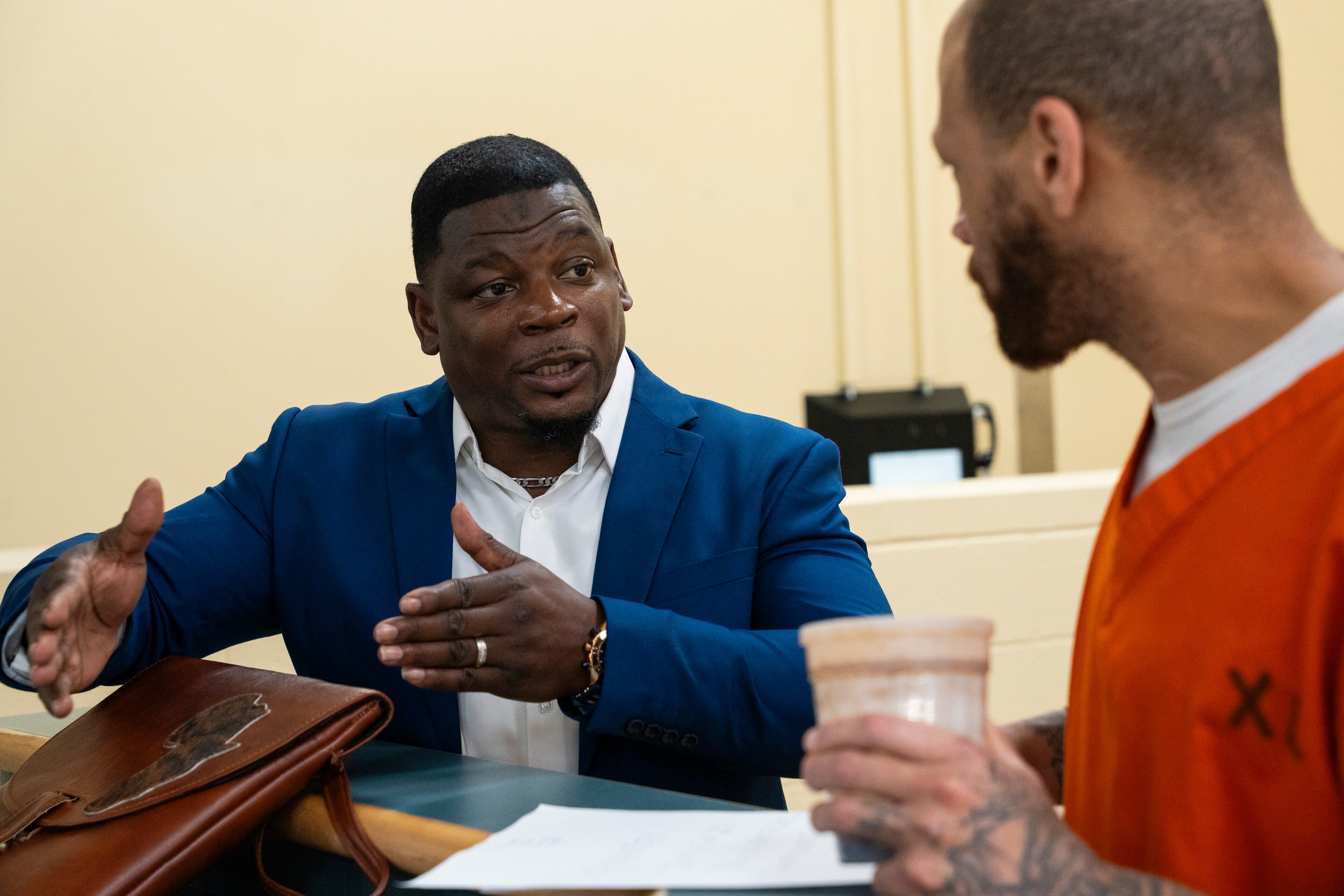 Shane Sims speaks with an inmate in the Athens-Clarke County Jail. The jail has embarked on a bold experiment aimed at making it less likely inmates will return after they’re set free. (Olivia Bowdoin for the AJC)