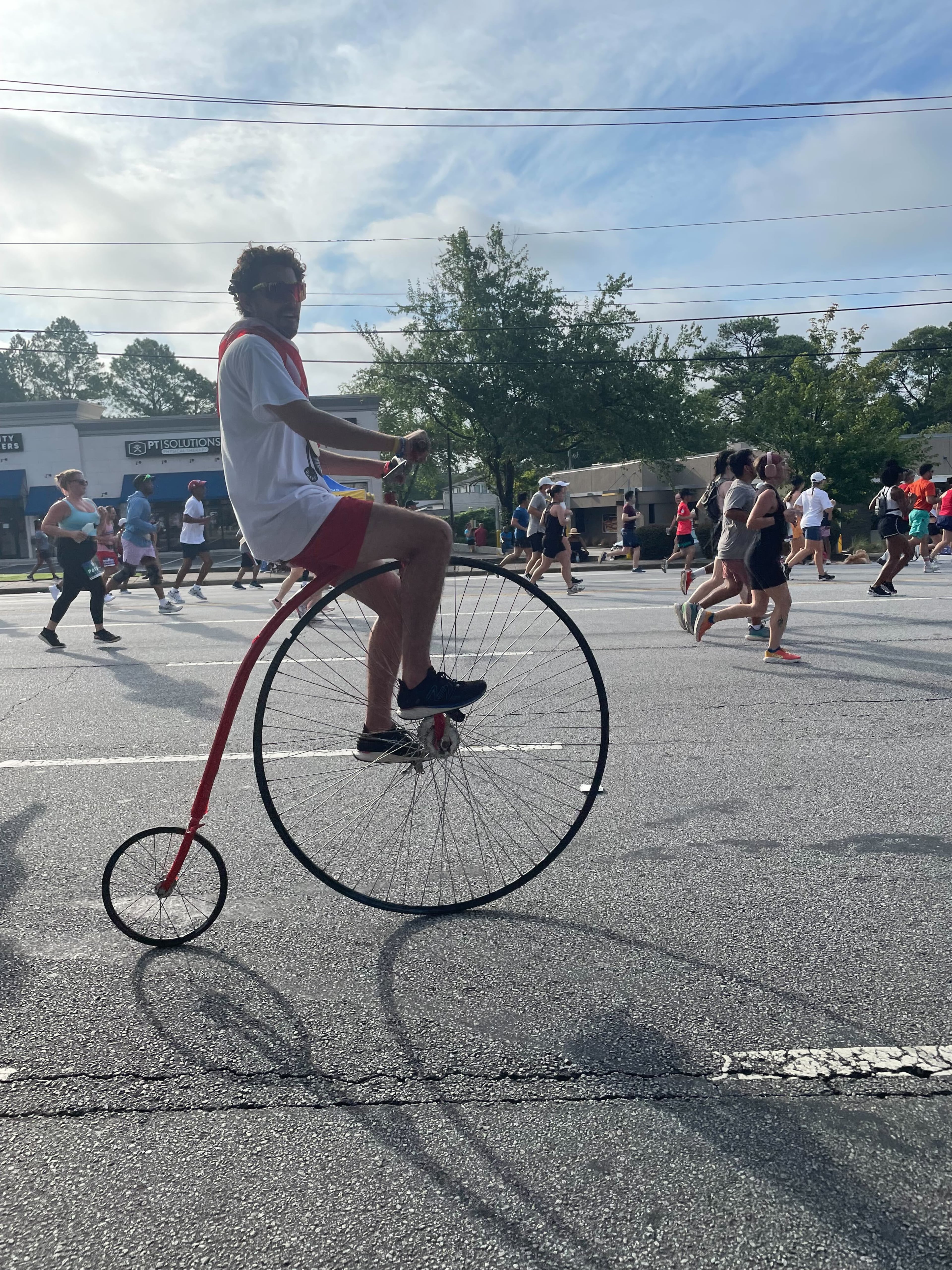 Riding special bikes in honor of a late friend at The Atlanta Journal-Constitution Peachtree Road Race on Thursday, July 4, 2024. (Photo: Anisah Muhammad/AJC)
