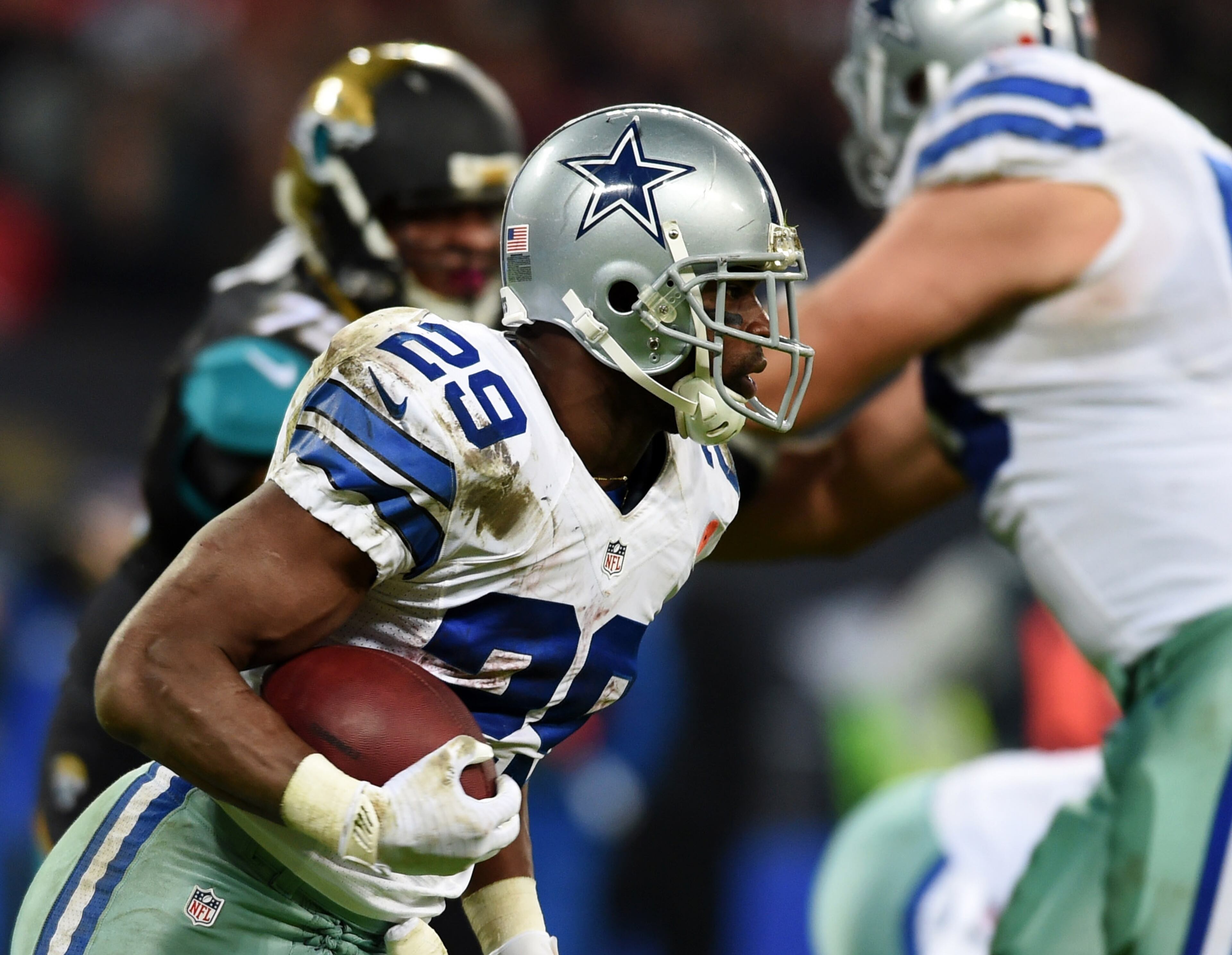 Dallas Cowboys running back DeMarco Murray (29) runs the ball against the Jacksonville Jaguars during the second half of an NFL football game at Wembley Stadium, London, Sunday, Nov. 9, 2014. (AP Photo/Tim Ireland)