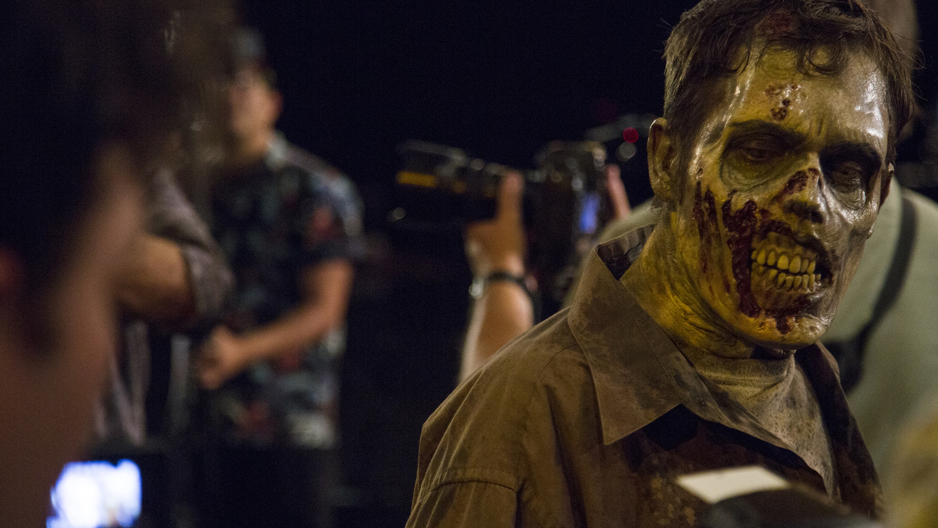 A zombie walks around and interacts with the media during a zombie bootcamp led by Greg Nicotero, co-executive producer and director of “The Walking Dead,” at the Globe Theater at Universal Studios on Wednesday, June 8, 2016. (Dillon Deaton/Los Angeles Times/TNS)