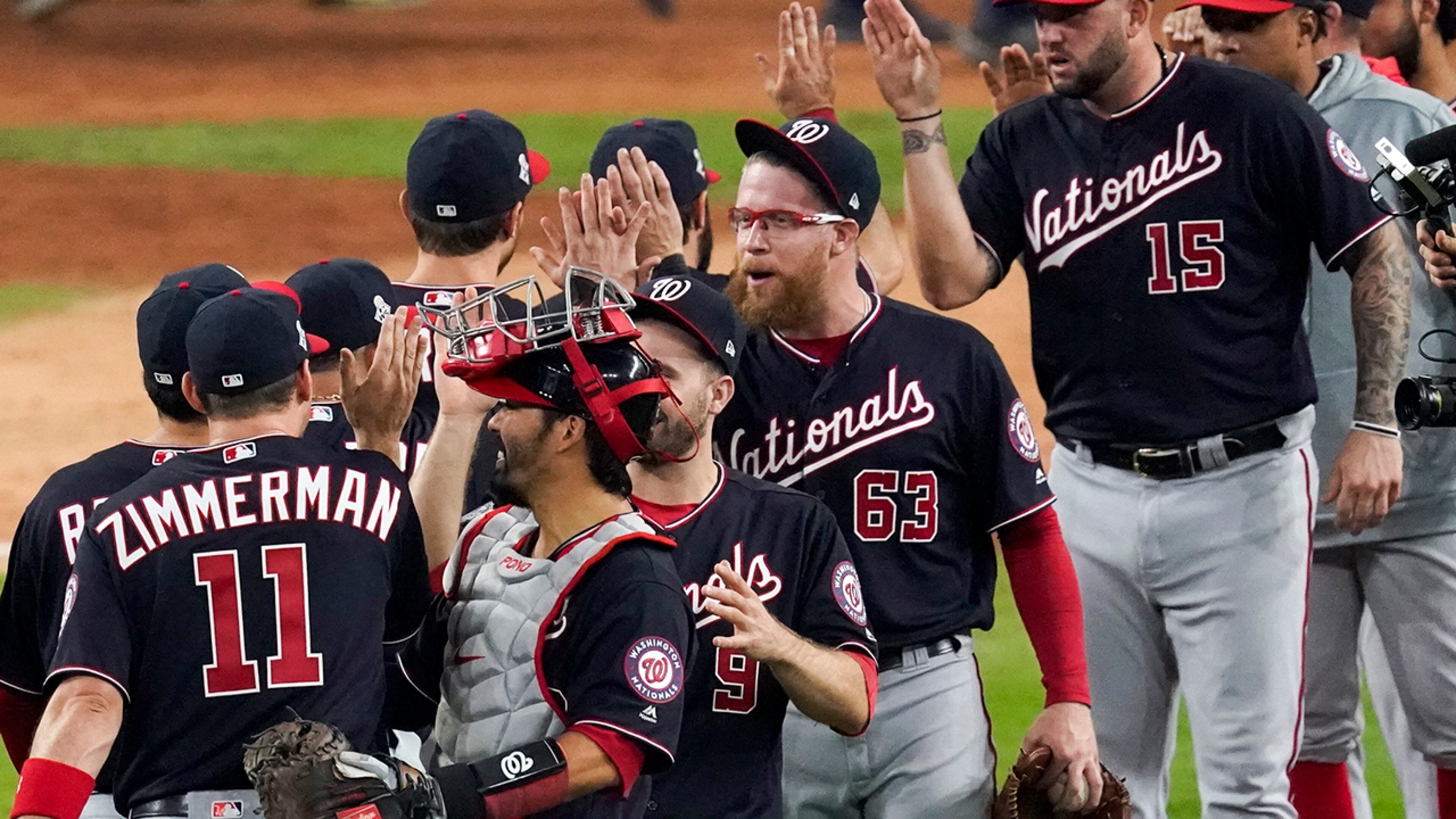 The Washington Nationals celebrate after Game 1 of the baseball World Series against the Houston Astros Tuesday, Oct. 22, 2019, in Houston. The Nationals won 5-4 to take a 1-0 lead in the series. (AP Photo/Eric Gay)