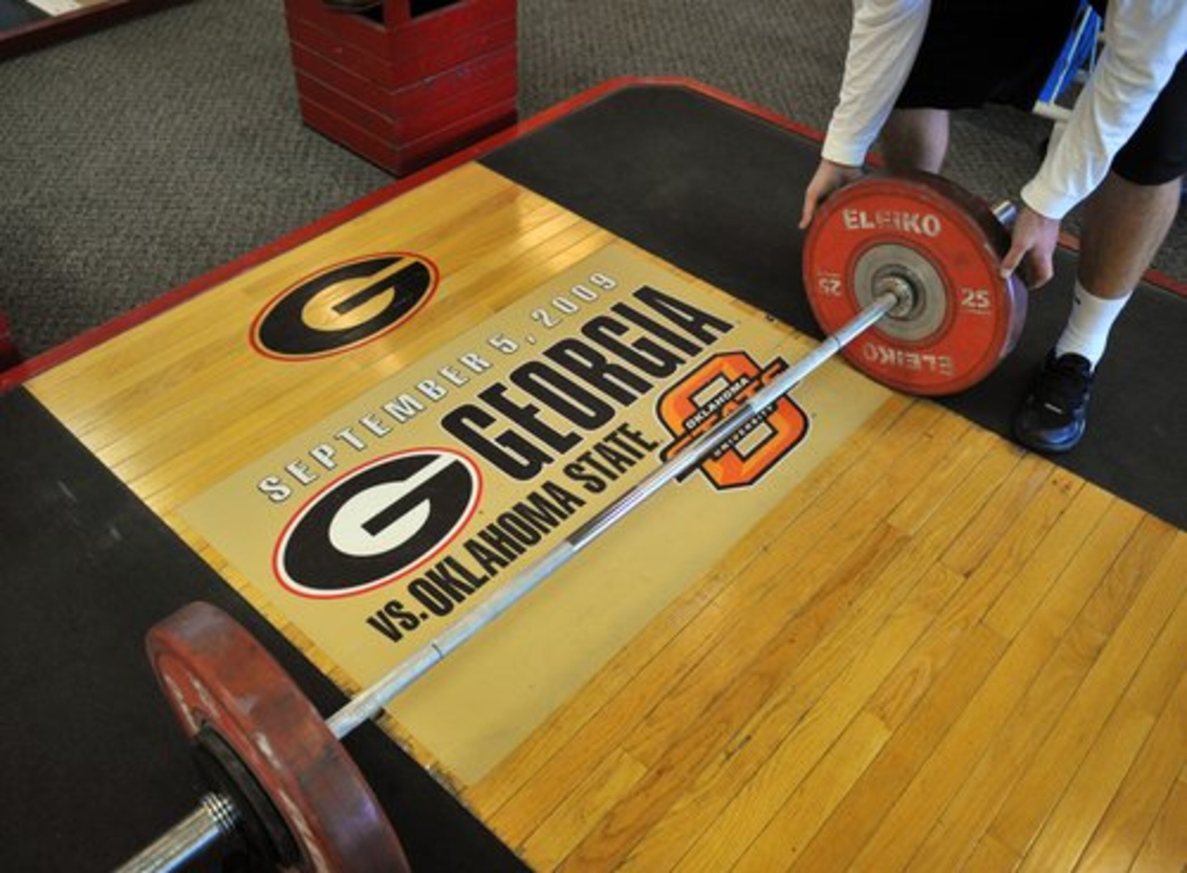 Mats in the Georgia weight room have the name and date of the key games of the season. First up, Oklahoma State on Sept. 5 in Stillwater.