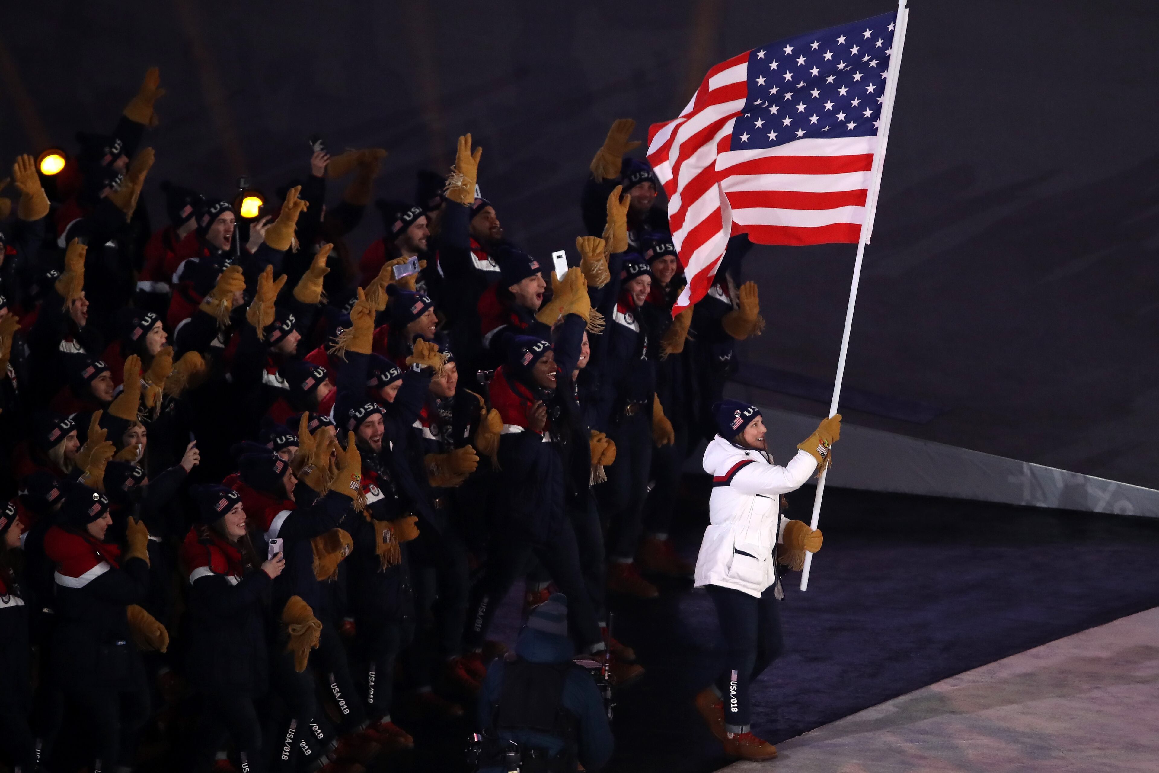 PYEONGCHANG-GUN, SOUTH KOREA - FEBRUARY 09: Flag bearer Erin Hamlin of the United States leads her team during the Opening Ceremony of the PyeongChang 2018 Winter Olympic Games at PyeongChang Olympic Stadium on February 9, 2018 in Pyeongchang-gun, South Korea. (Photo by Sean M. Haffey/Getty Images)