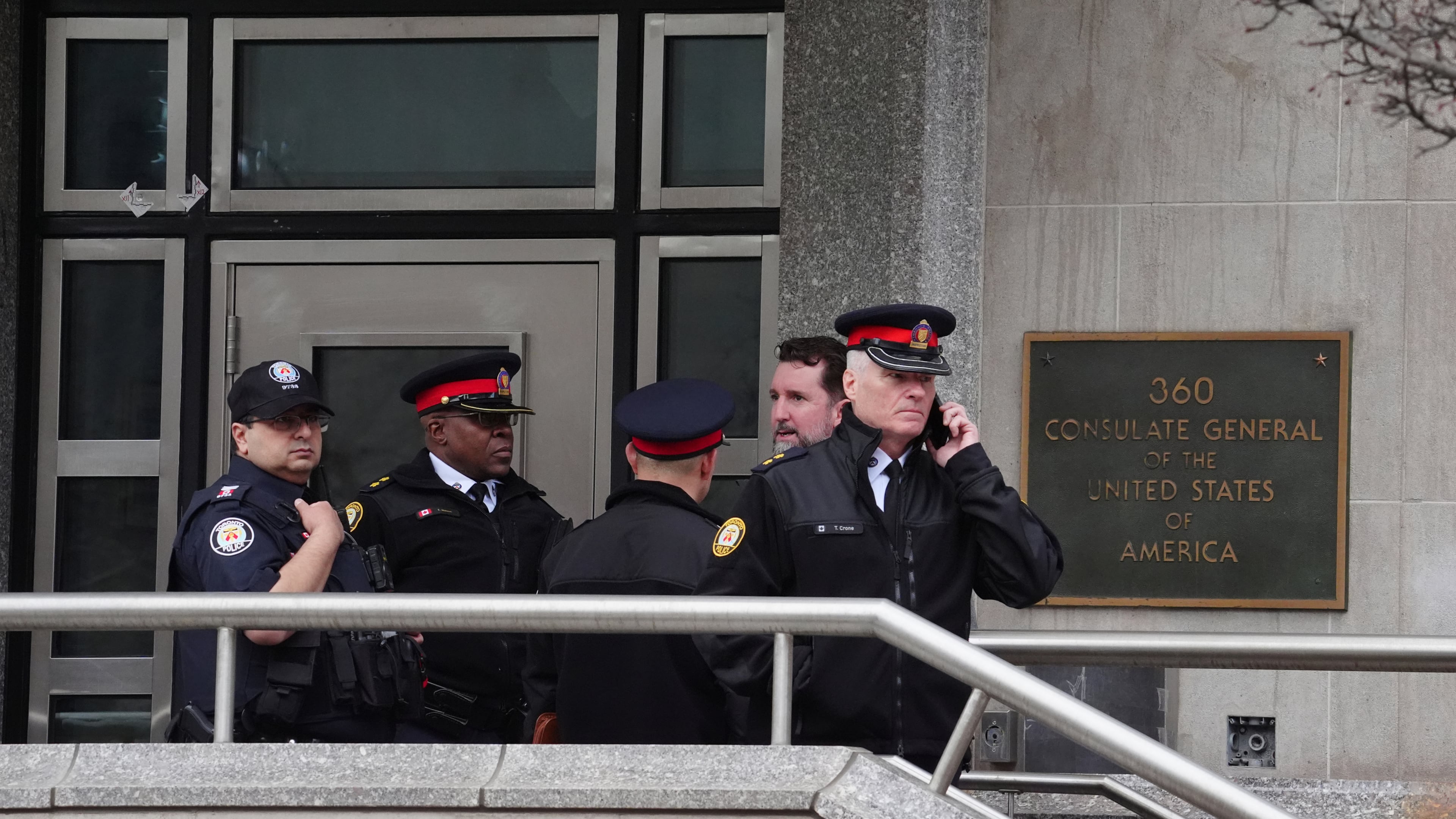 FILE - Toronto police officers investigate outside the U.S. consulate in Toronto on March 10, 2026. (Frank Gunn/The Canadian Press via AP, File)