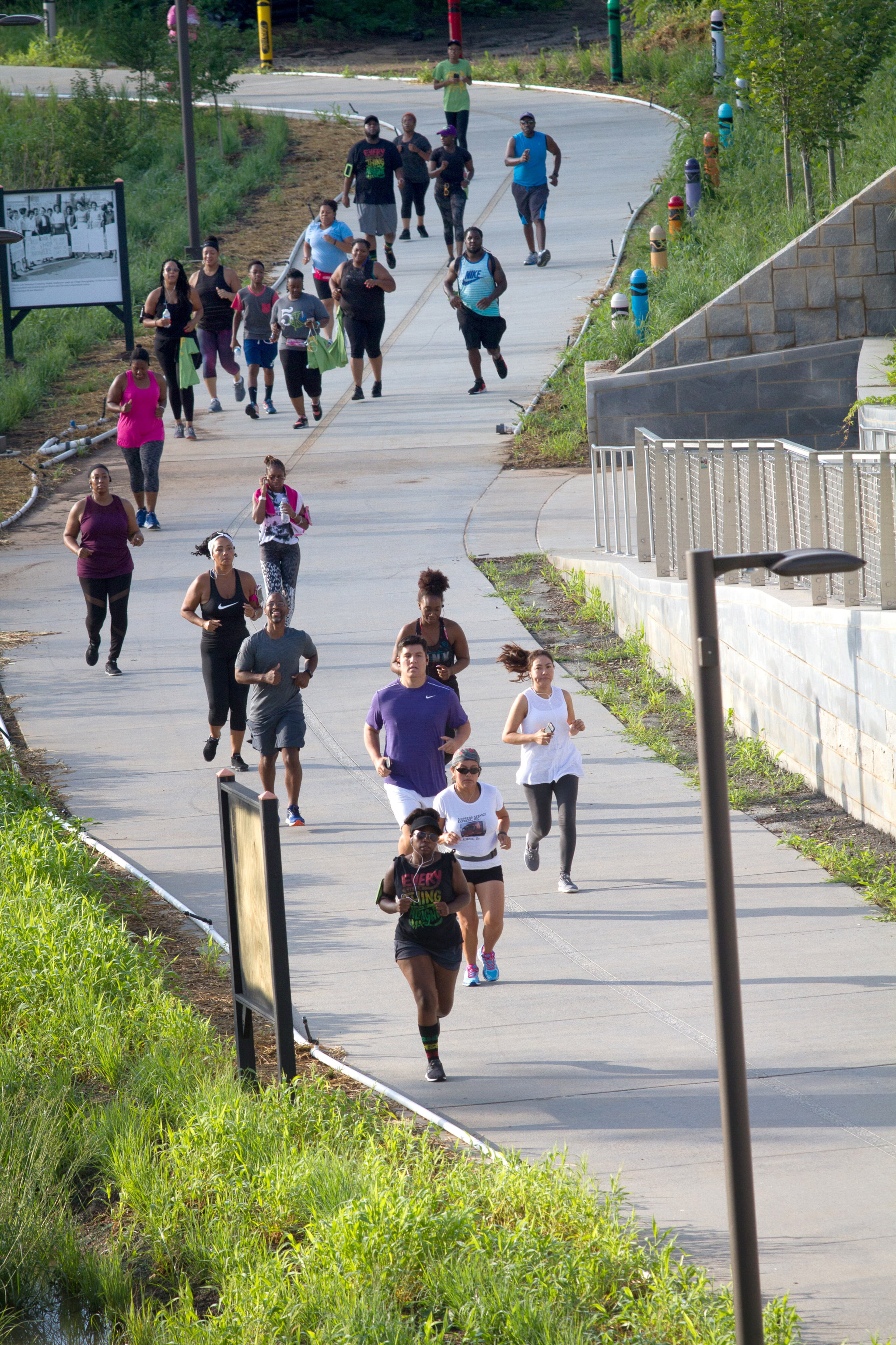 Runners head toward Washington Park on the Beltline Westside Trail at the beginning of the Be Reggae 5K Fun Run near Gordon-White Park in the West End Neighborhood Saturday, July 7, 2018. STEVE SCHAEFER / SPECIAL TO THE AJC