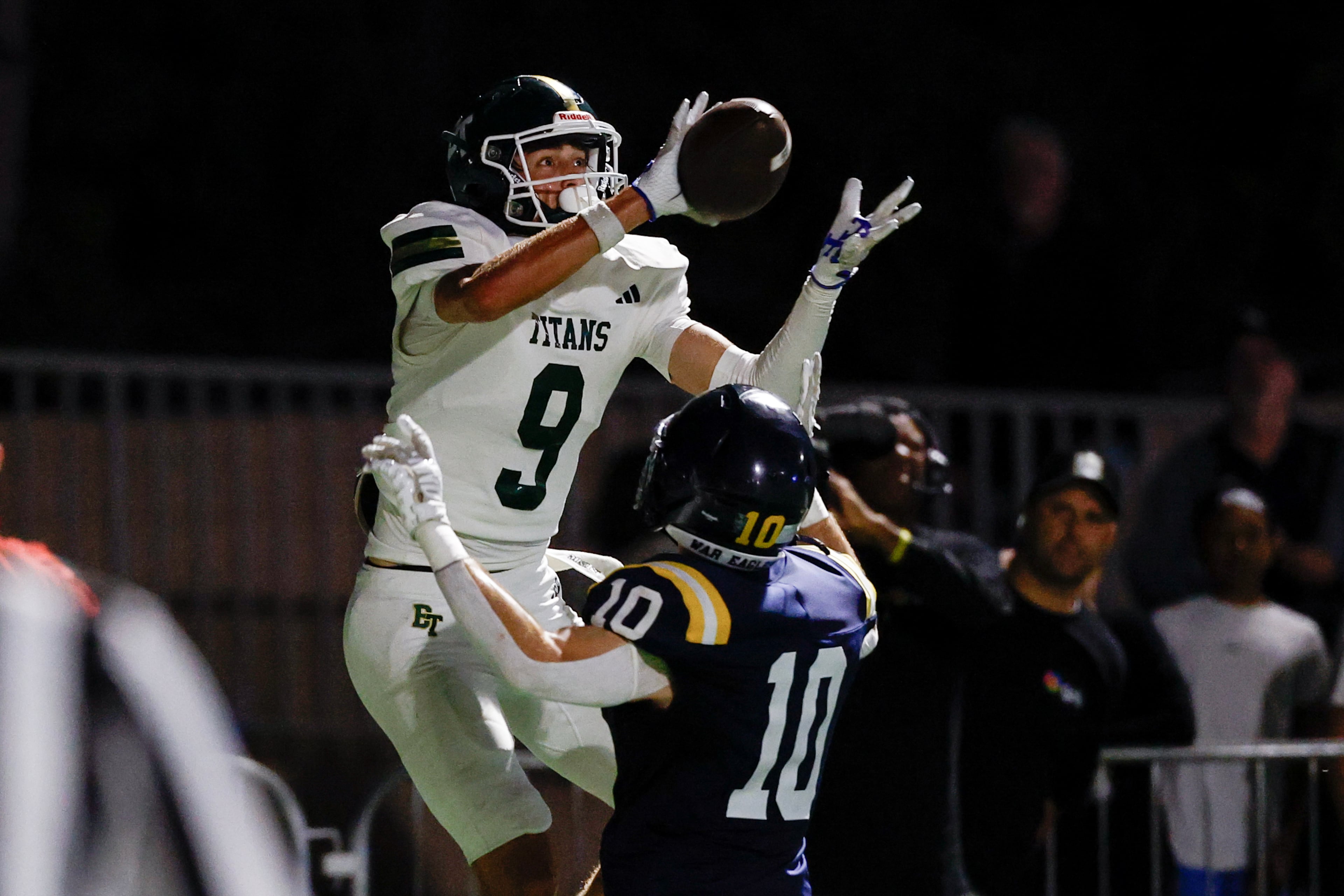 Blessed Trinity wide receiver Quinn Smith (left) makes a touchdown reception against Marist’s Engin McCarthy during their game on Friday, Sept. 25, 2026, in Atlanta. (Erik S. Lesser for the AJC)