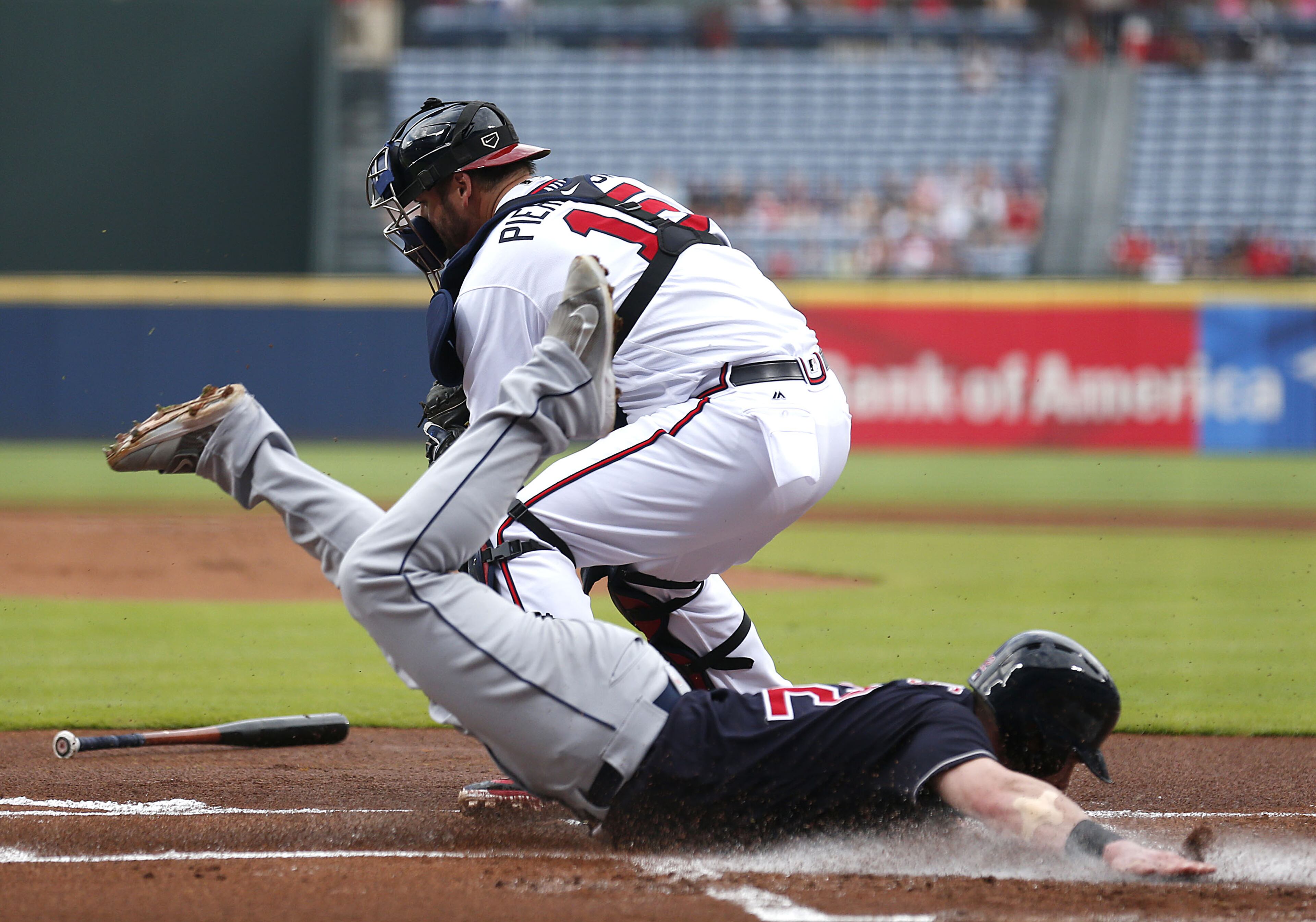 ATLANTA, GA - JUNE 28: Second baseman Jason Kipnis #22 of the Cleveland Indians slides into home behind the throw to catcher A.J. Pierzynski #15 of the Atlanta Braves to score in the first inning during the game at Turner Field on June 28, 2016 in Atlanta, Georgia. (Photo by Mike Zarrilli/Getty Images)
