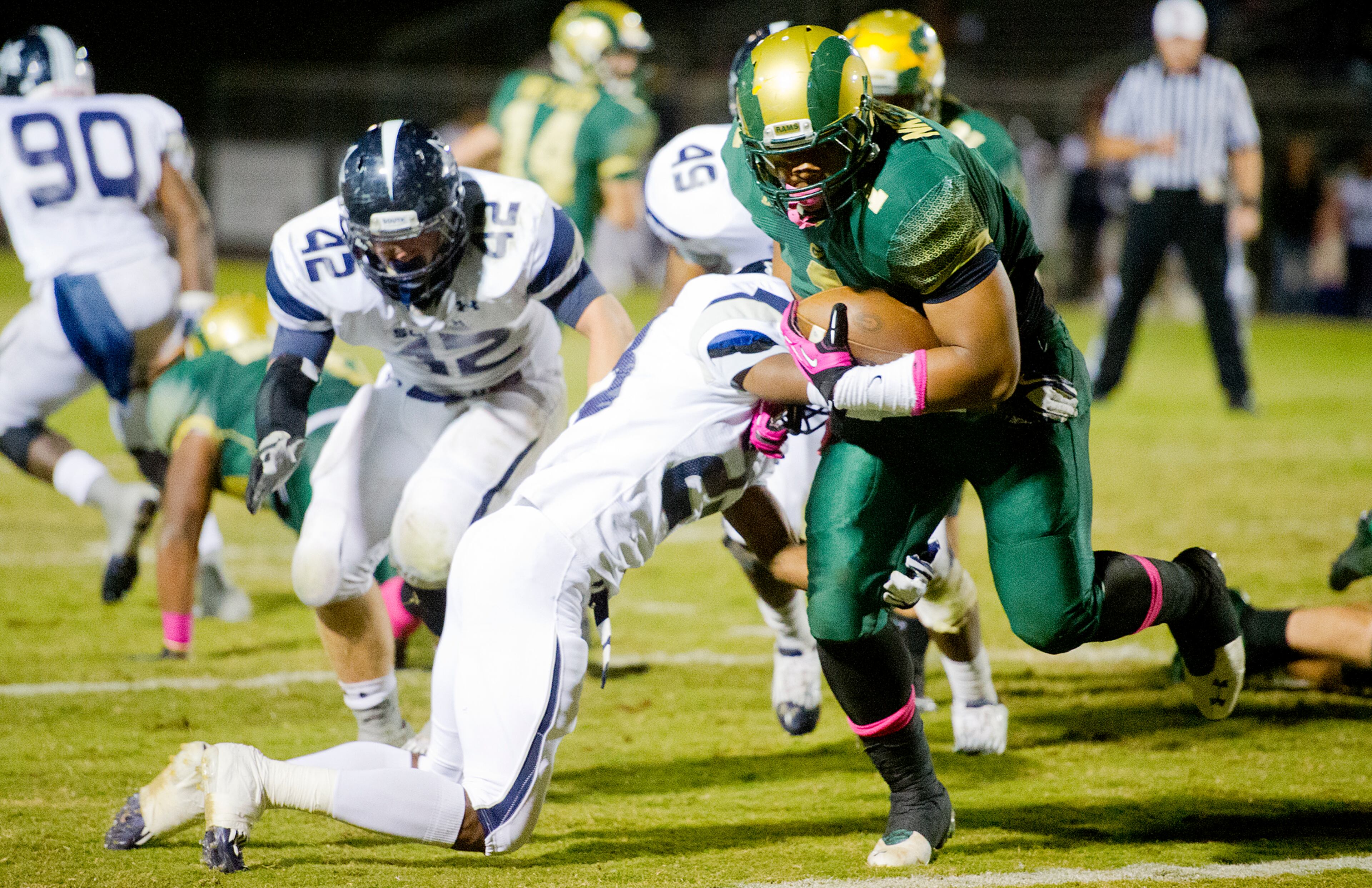 Grayson's Robert Nkemdiche (right) breaks a tackle by South Gwinnett's Najee Morrison to score a touchdown.