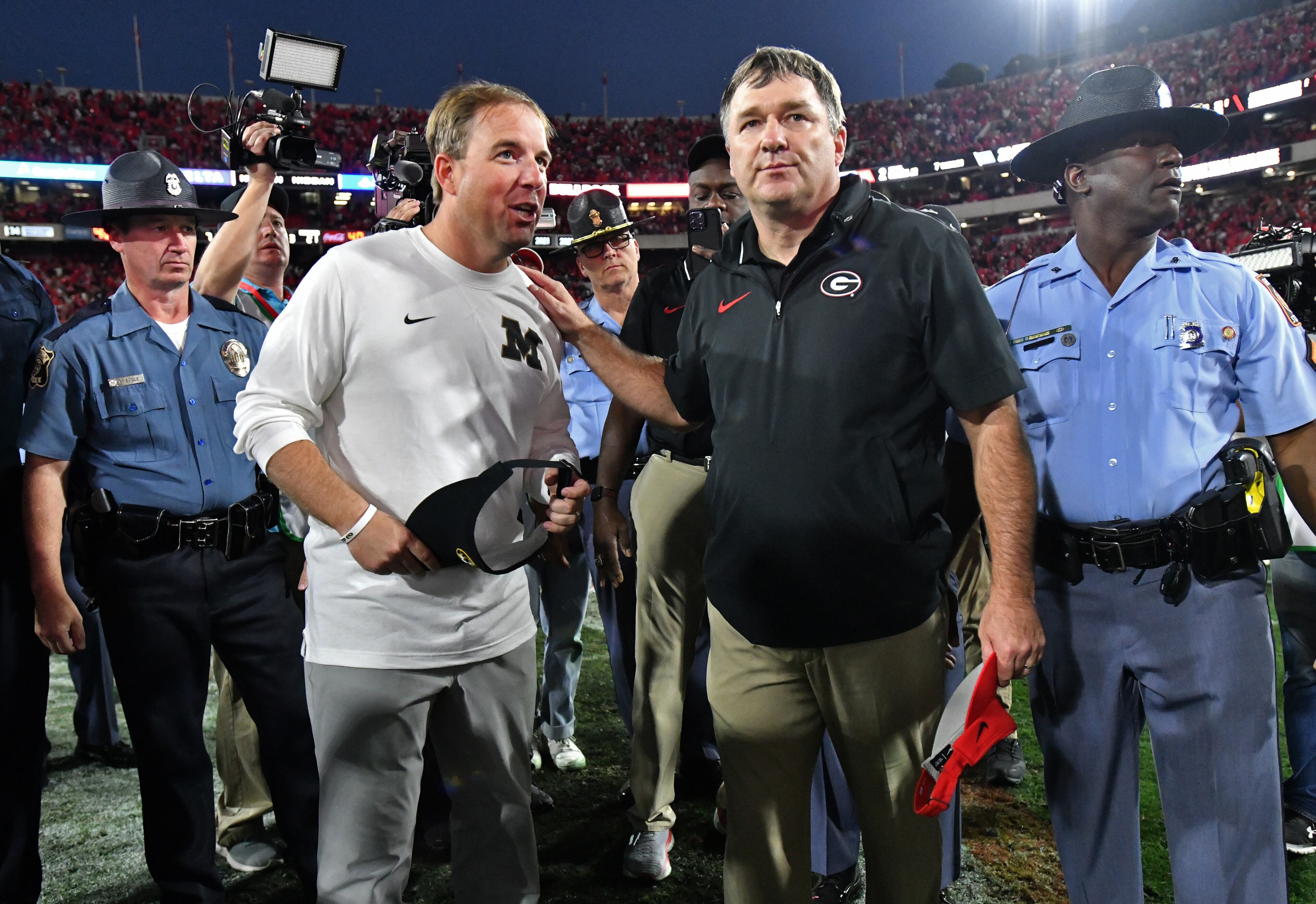 Georgia head coach Kirby Smart and Missouri head coach Eliah Drinkwitz greet each other after Georgia beat Missouri during an NCAA football game at Sanford Stadium, Saturday, November 4, 2023, in Athens. Georgia won 30-21 over Missouri. (Hyosub Shin / Hyosub.Shin@ajc.com)