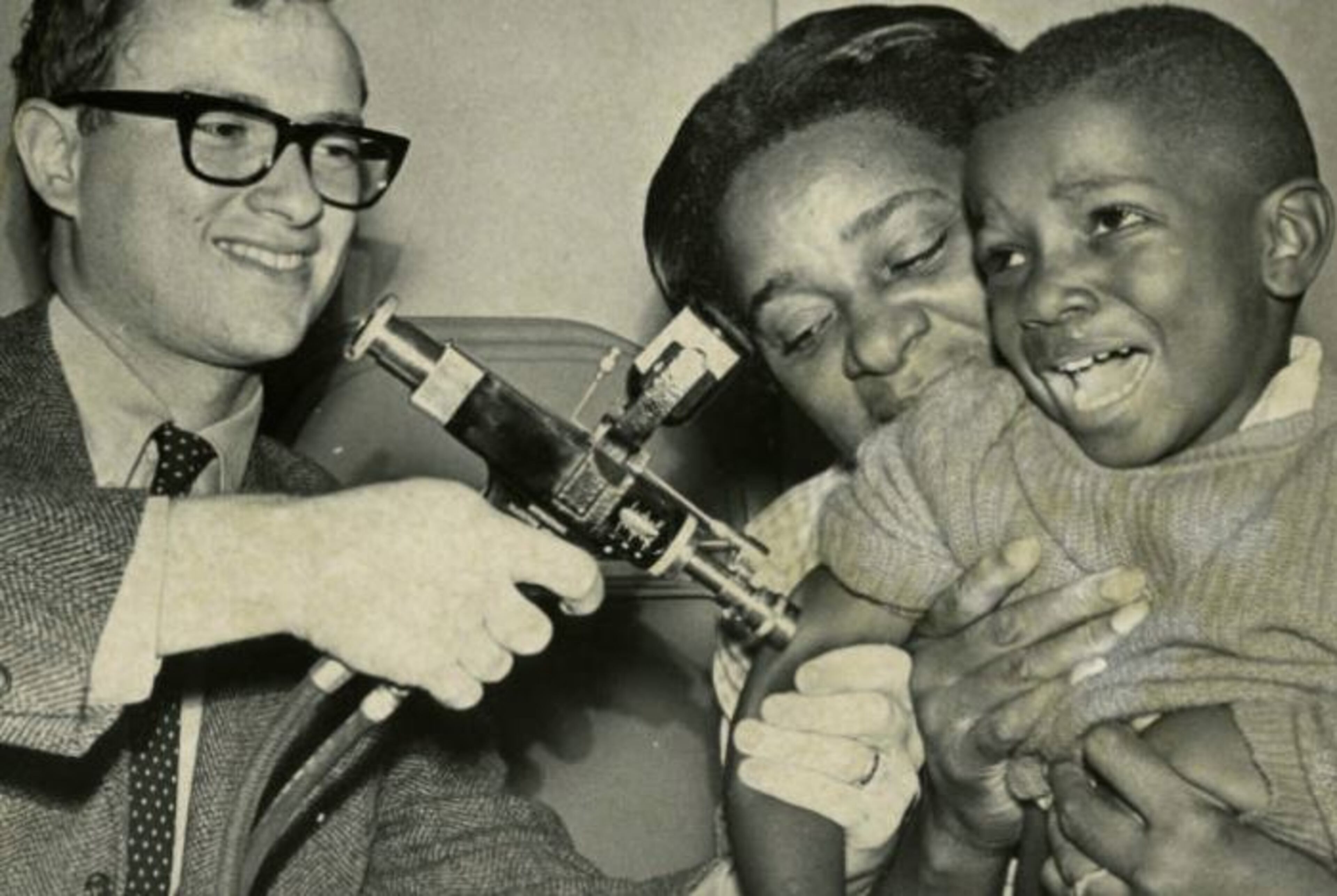 Oct. 1968 -- Little David Hunter yelps as Doctor William Likosky gives him a shot of the measles vaccine at the Southside Child Development Center in Atlanta. DWIGHT ROSS JR. / AJC PHOTO ARCHIVES