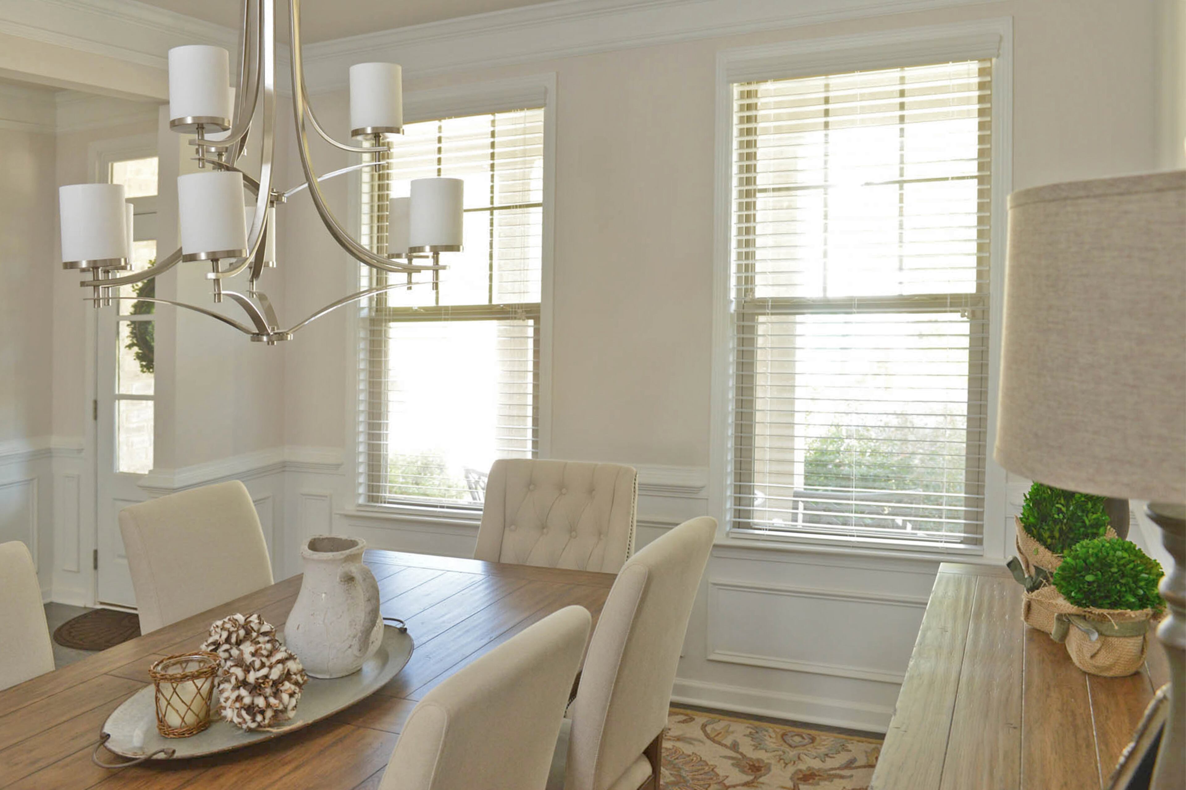 An umbrella shades the table for the family to dine outdoors on the patio, which is accessible from the open kitchen and living room. Their patio furniture is a mix of pieces from family members and found at various antique and vintage shops.