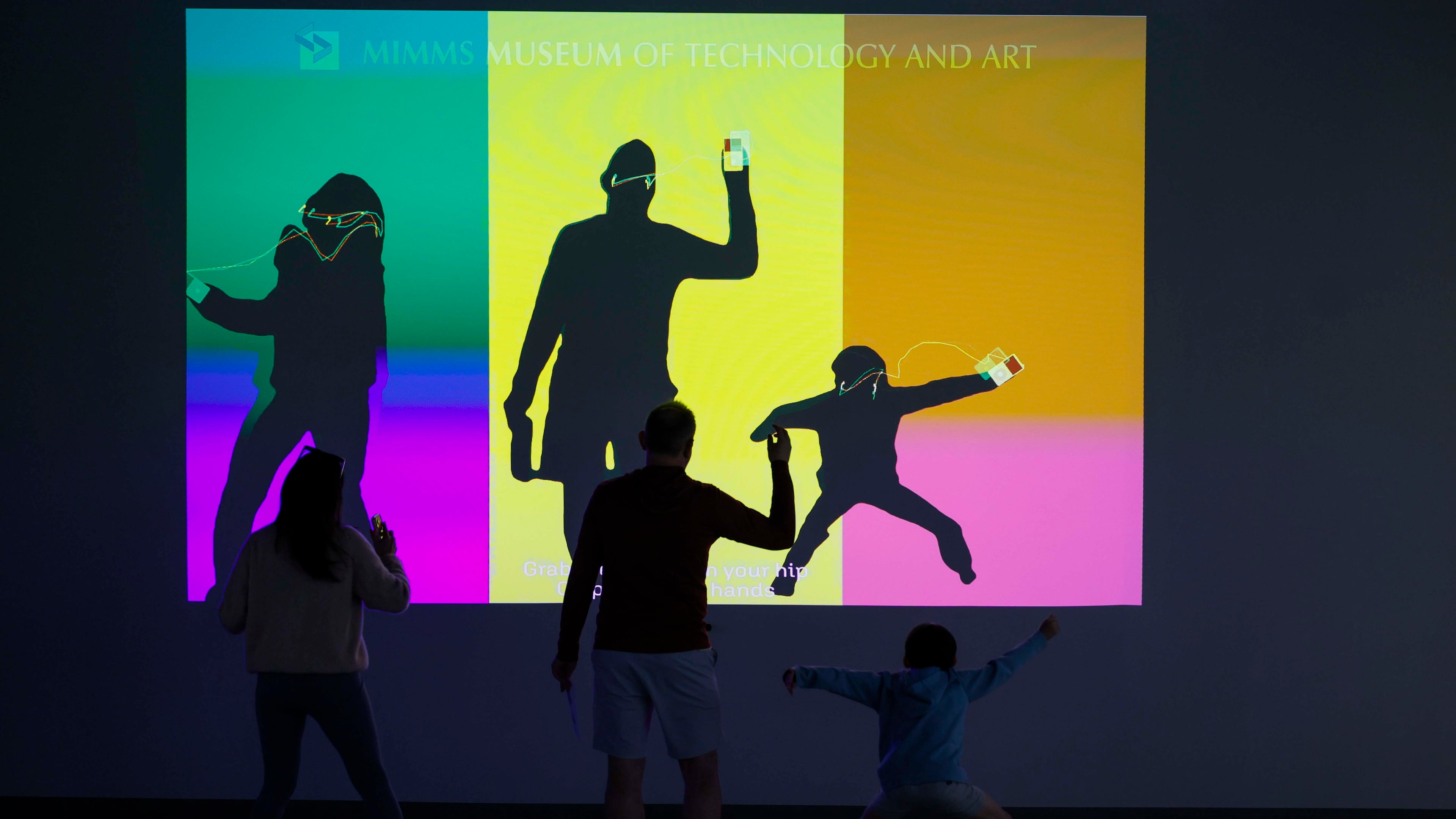 A family plays with an interactive iPod screen at the "50 Years of Innovation from Apple" exhibit at the Mimms Museum in Roswell on Sunday, April 19, 2026.
(Miguel Martinez/AJC)