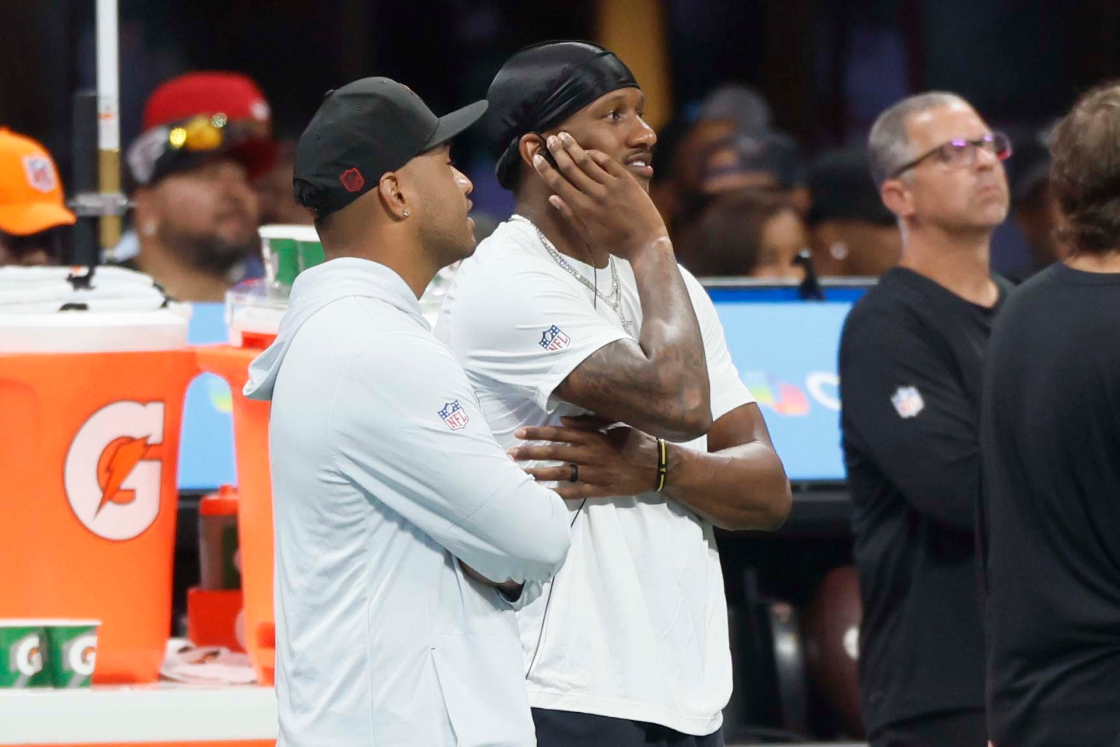 Atlanta Falcons quarterbacks Michael Penix Jr. (9) and Tua Tagovailoa (1) watch from the sidelines following a play in the second half of an NFL game against the Carolina Panthers at Mercedes-Benz Stadium in Atlanta on Sunday, Sept. 20, 2026. (Miguel Martinez/AJC)