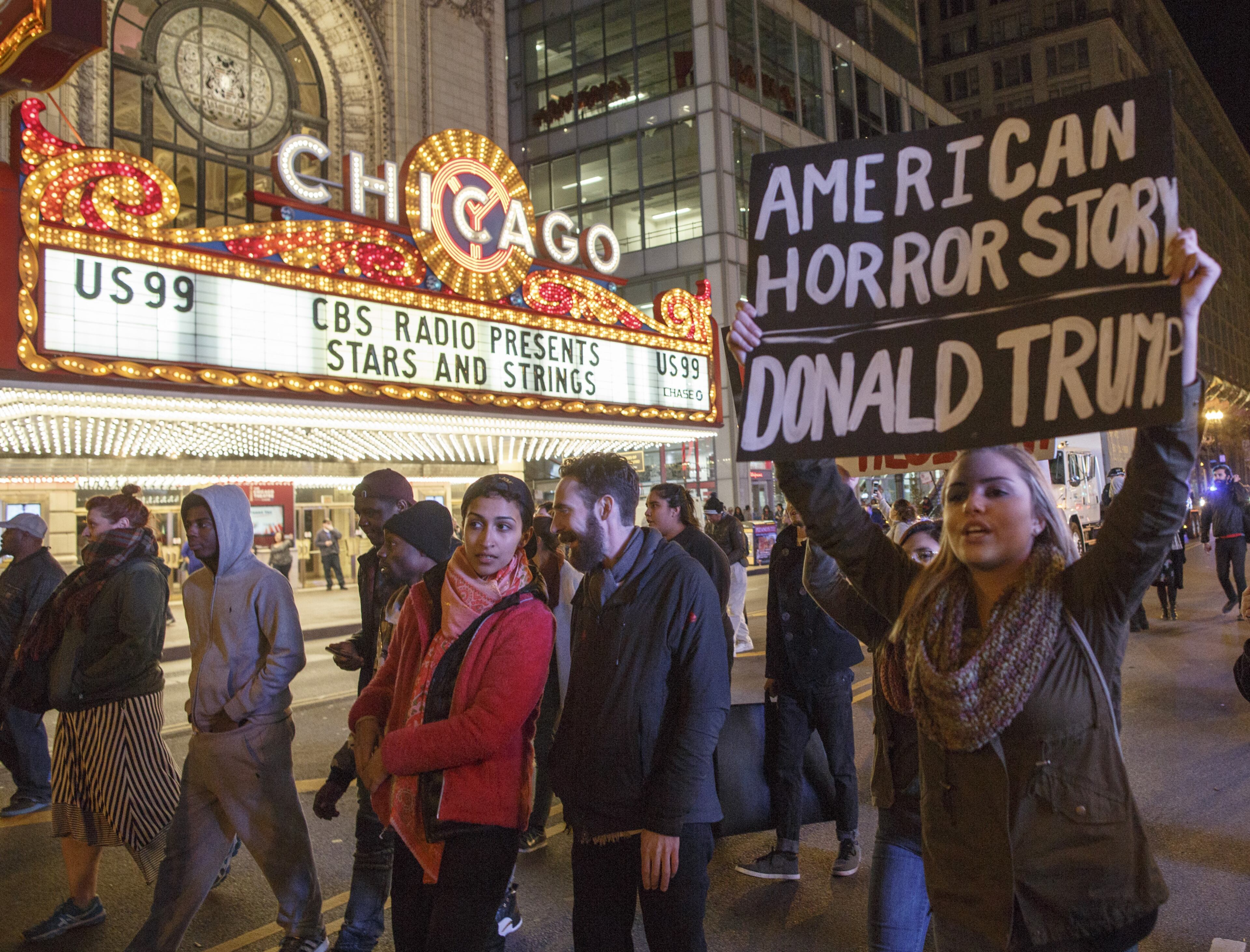 CHICAGO, IL - NOVEMBER 09: Demonstrators protest outside the Chicago Theatre November 9, 2016 in Chicago, Illinois. Thousands of people across the United States took to the streets in protest a day after Republican Donald Trump was elected president, defeating Democrat Hillary Clinton. (Photo by John Gress/Getty Images)