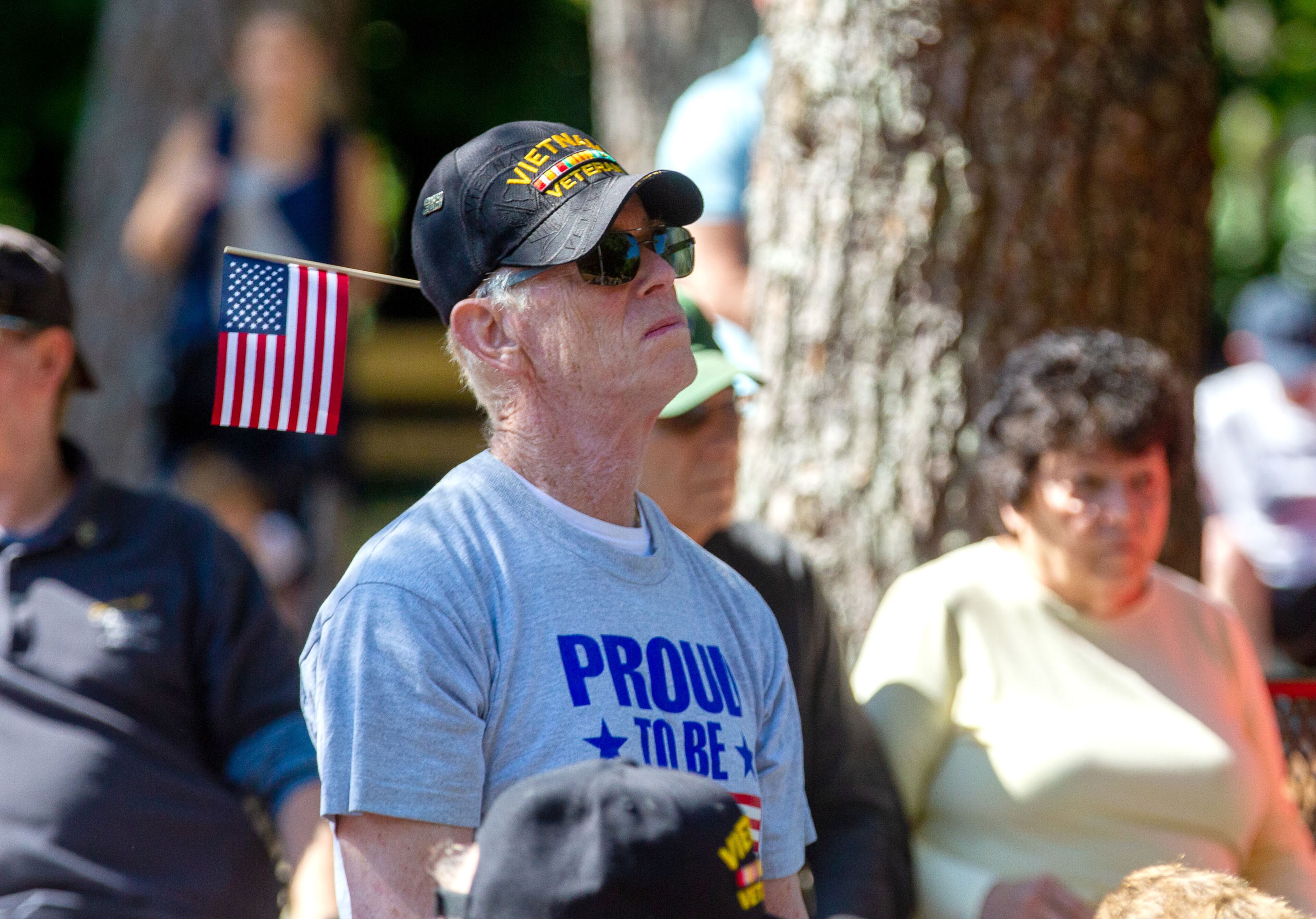 People listen to Captain Steve Bradshaw speak during the city of Dunwoody remembrance ceremony at Brook Run Park Monday, May 31, 2021. STEVE SCHAEFER FOR THE ATLANTA JOURNAL-CONSTITUTION