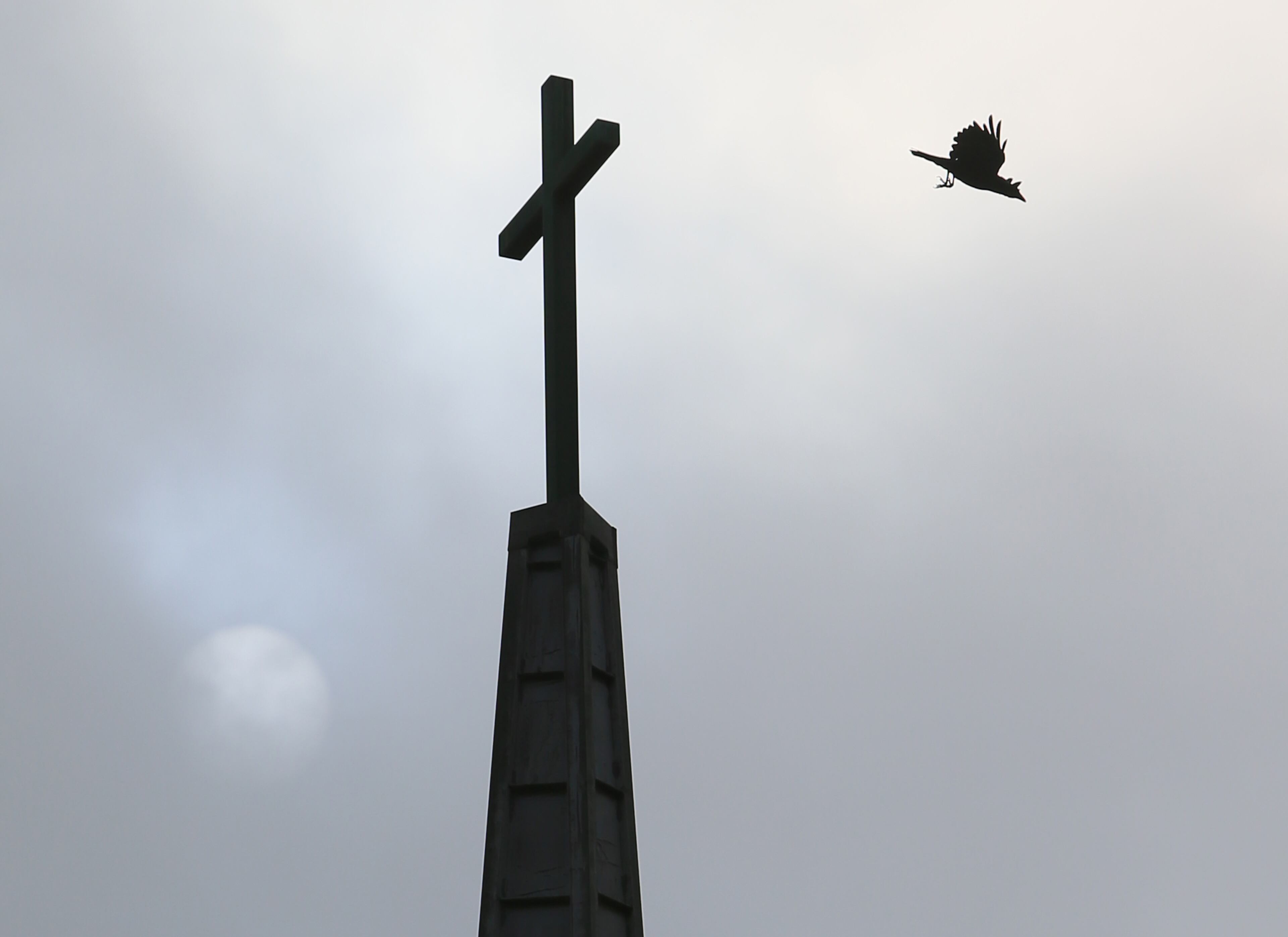 A bird flys from the top of the church steeple at Mt. Vernon Baptist Church on Sunday, Sept. 15, 2013, in Atlanta.
