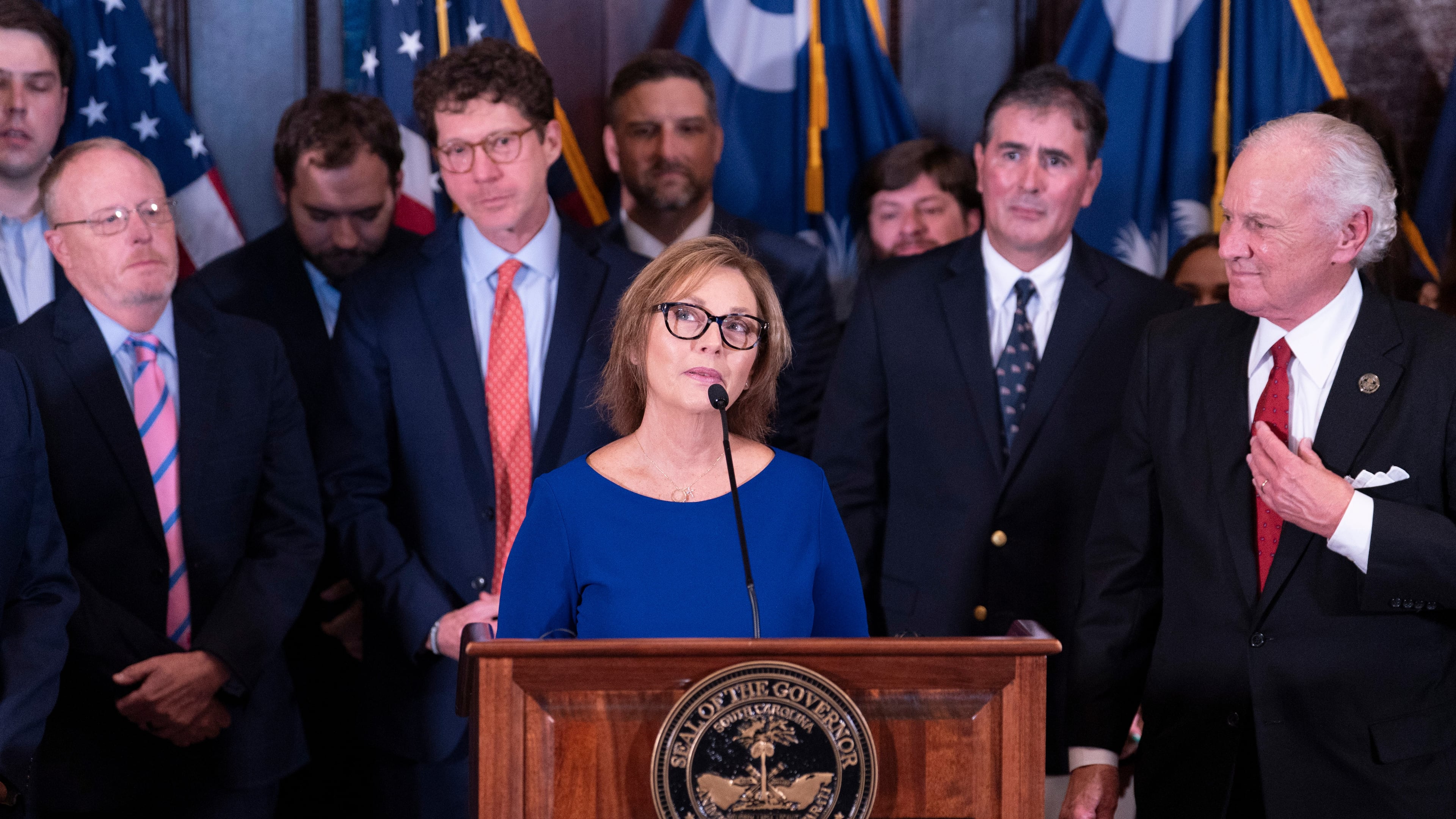 Newly appointed U.S. interim Senator, Darline Graham Nordone, with South Carolina Gov. Henry McMaster, right, speaks to members of the press after being appointed of to fill the vacancy created by the passing of her brother, U.S. Senator Lindsey Graham, at the statehouse Monday, July 13, 2026, in Columbia, S.C. (AP Photo/Sean Rayford)