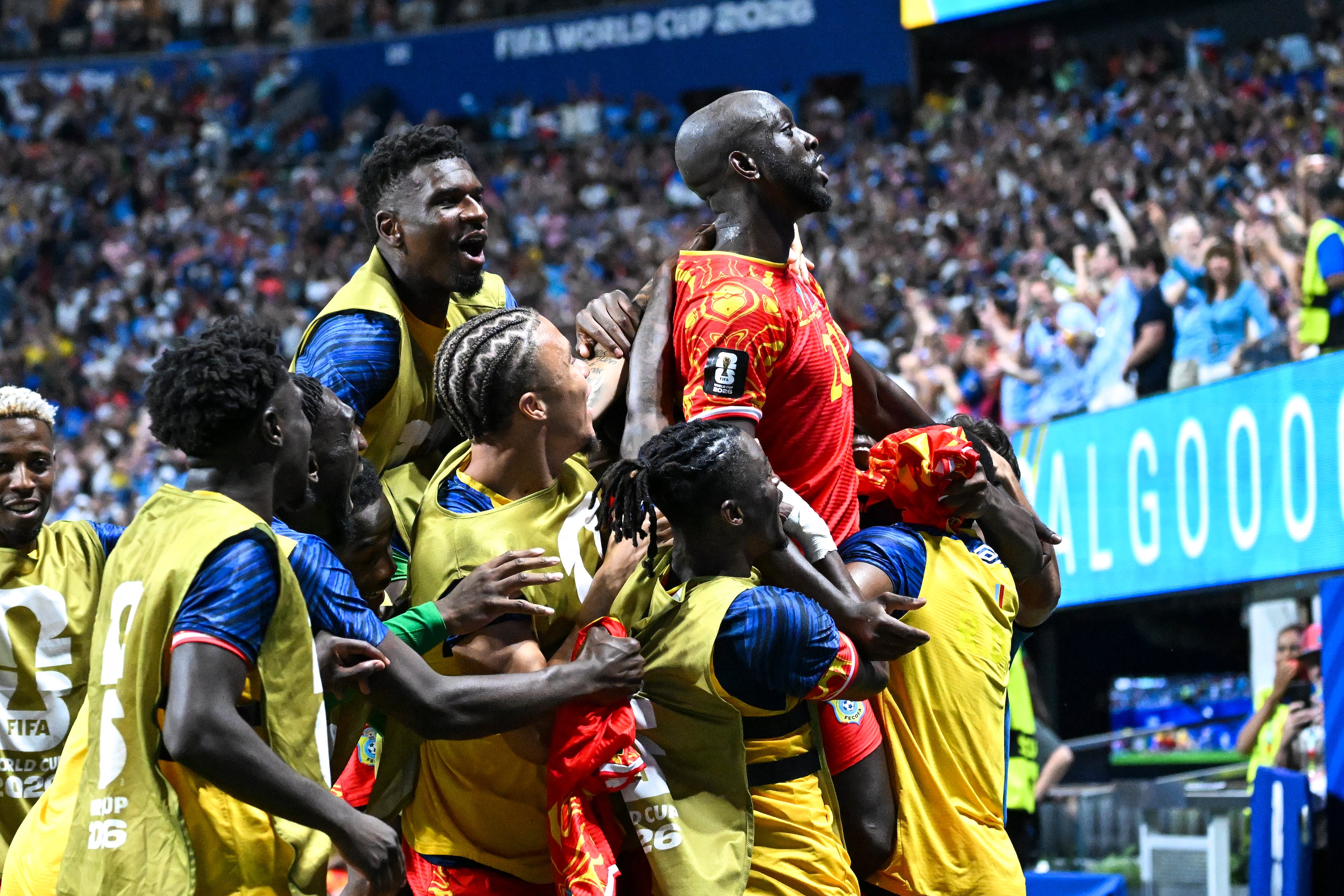 DR Congo forward Yoane Wissa (20) is joined by teammates as they celebrate a 3-1 win over Uzbekistan during the second half of a FIFA World Cup match at Atlanta Stadium (Mercedes-Benz Stadium) on Saturday, June 27, 2026, in Atlanta. (Hyosub Shin/AJC)