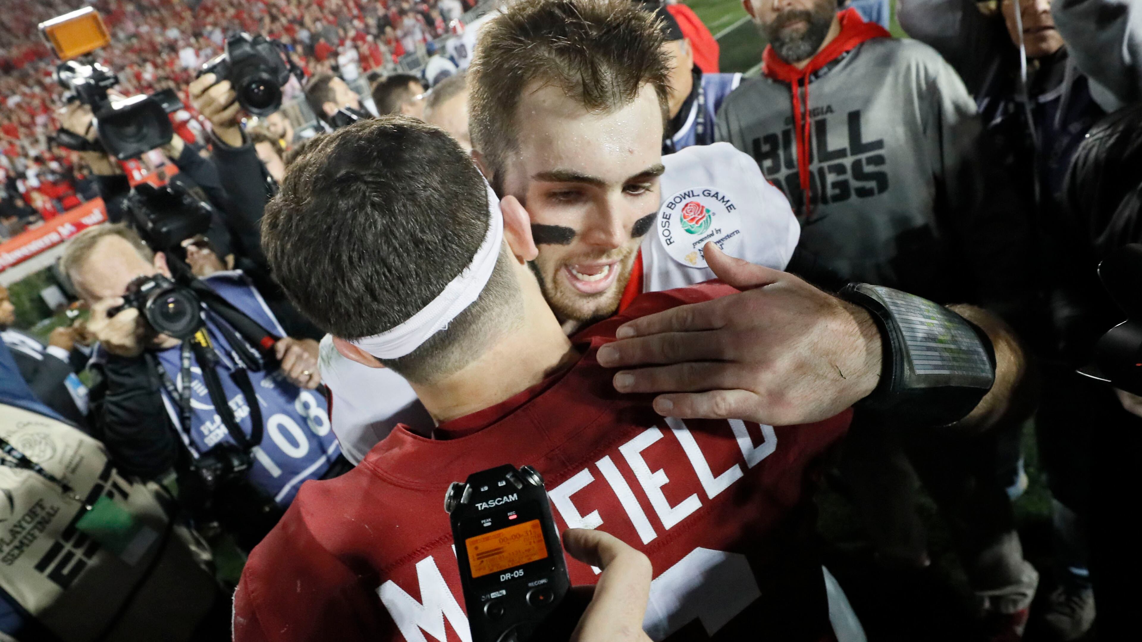 1/1/18 - Pasadena - Oklahoma Sooners quarterback Baker Mayfield (6) congratulates Georgia Bulldogs quarterback Jake Fromm (11) after Georgia won the College Football Playoff Semifinal at the Rose Bowl Game on Monday, January 1, 2018, in Pasadena. BOB ANDRES /BANDRES@AJC.COM