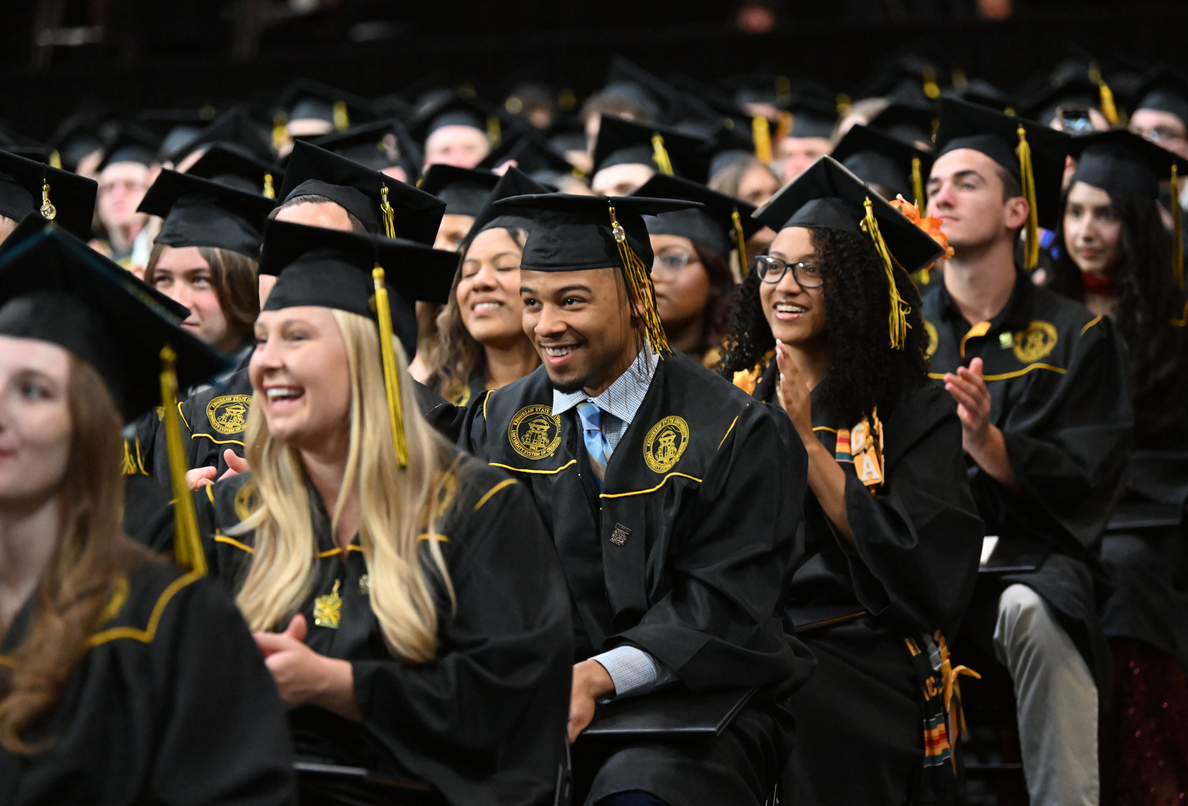 Graduates react during Kennesaw State University’s spring commencement ceremony in May. (Hyosub Shin/AJC)