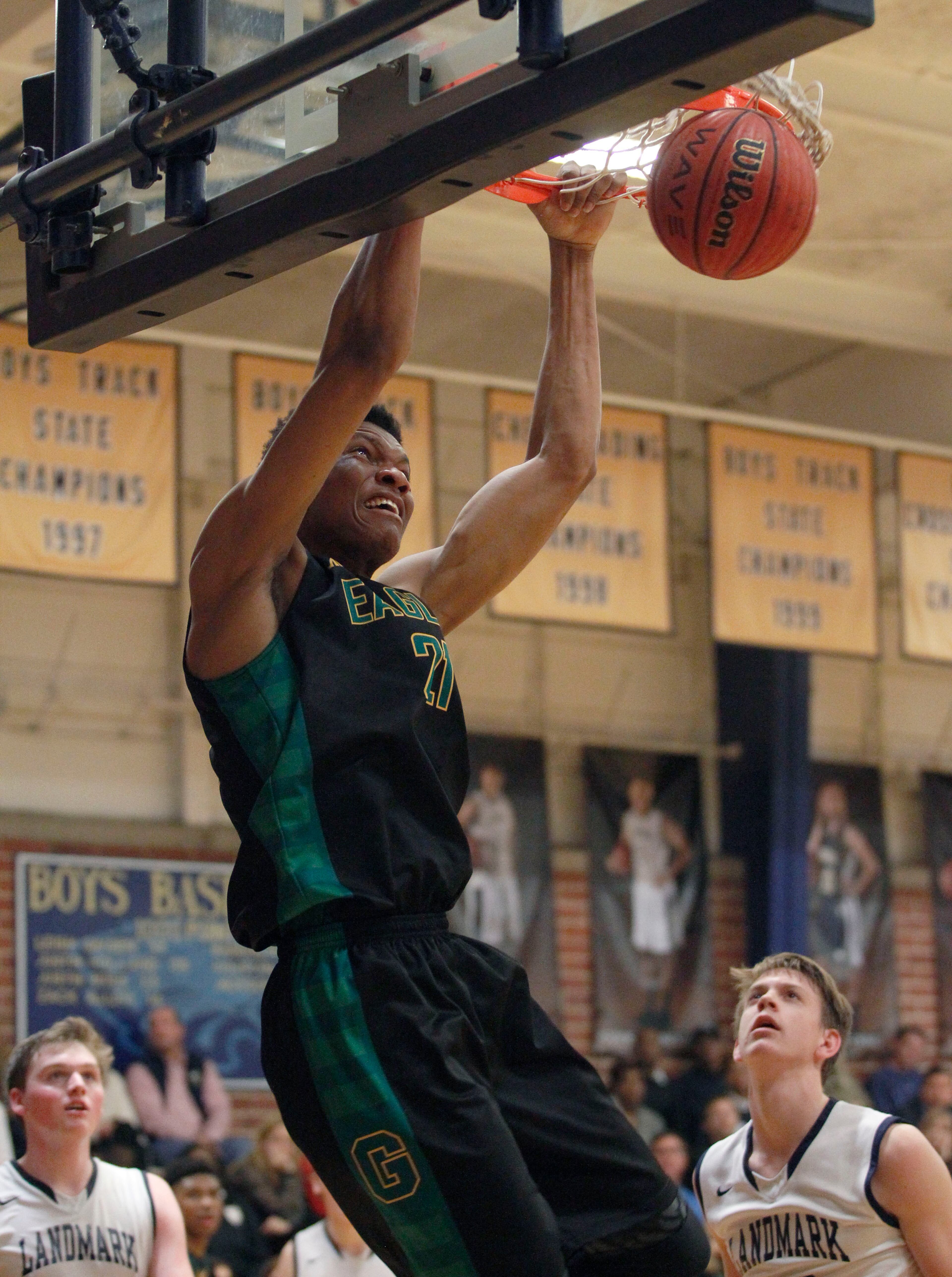 Greenforest Christian Ikey Obiagu (21) dunks against Landmark Christian defense at a high school basketball game at Landmark Christian school Friday, February 5, 2016. TAMI CHAPPELL/SPECIAL TO THE AJC