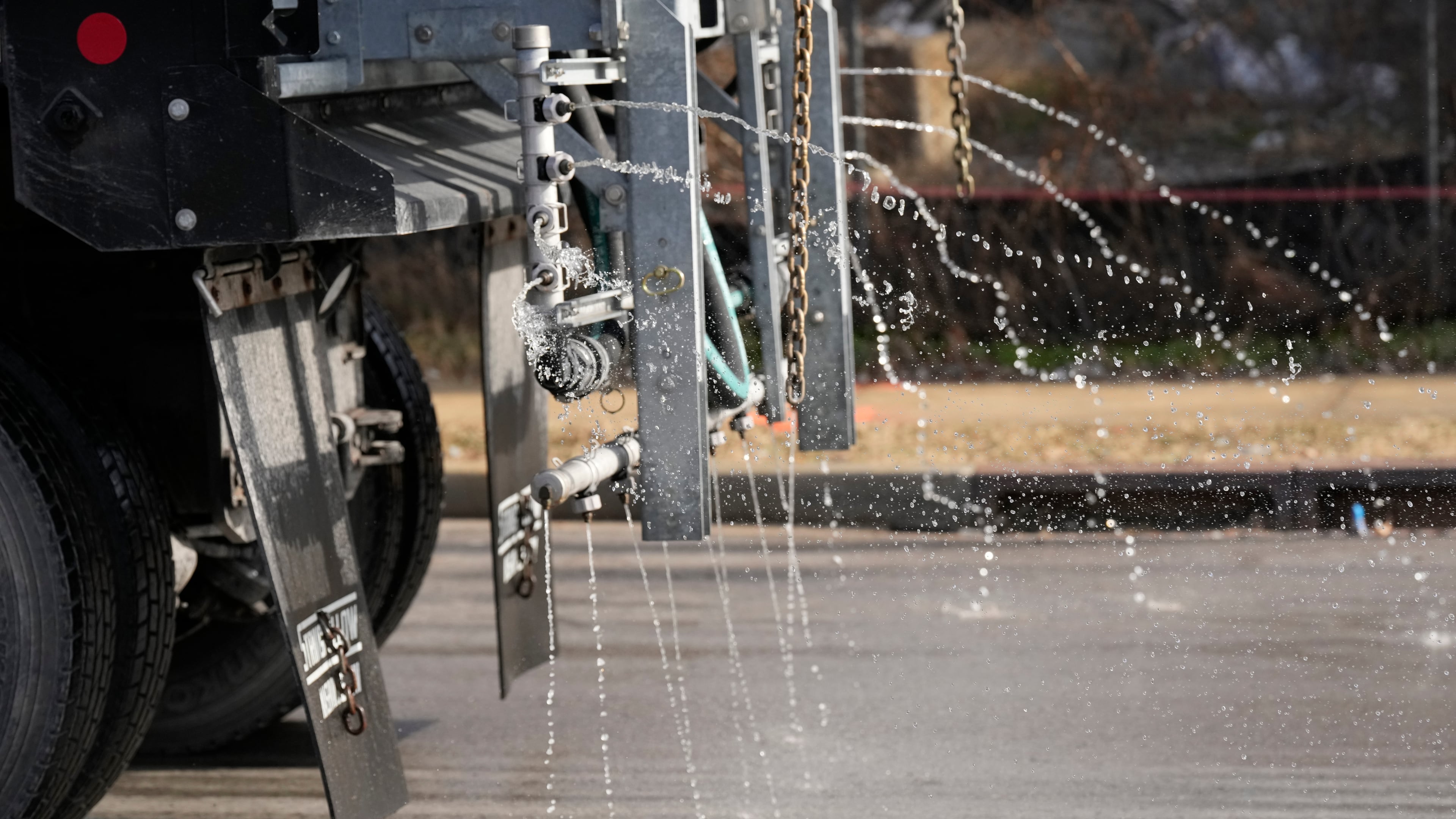 A Nashville Department of Transportation truck applies salt brine to a roadway Thursday, Jan. 22, 2026, in Nashville, Tenn. ahead of a winter storm expected to hit the state over the weekend. (AP Photo/George Walker IV)