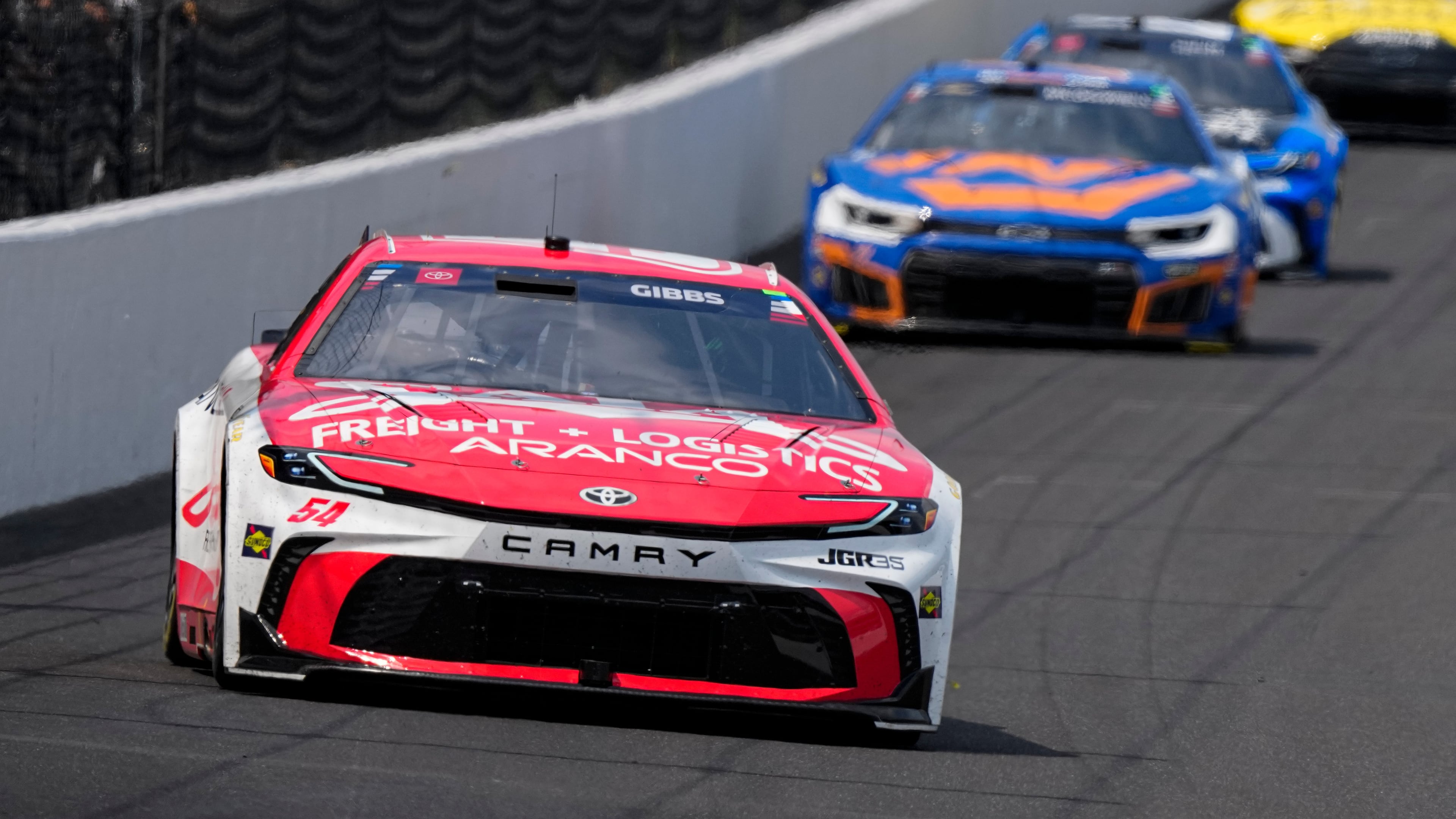 Ty Gibbs (54) heads into the first turn during a NASCAR Cup Series auto race at Indianapolis Motor Speedway in Indianapolis, Sunday, July 26, 2026. (AP Photo/Michael Conroy)