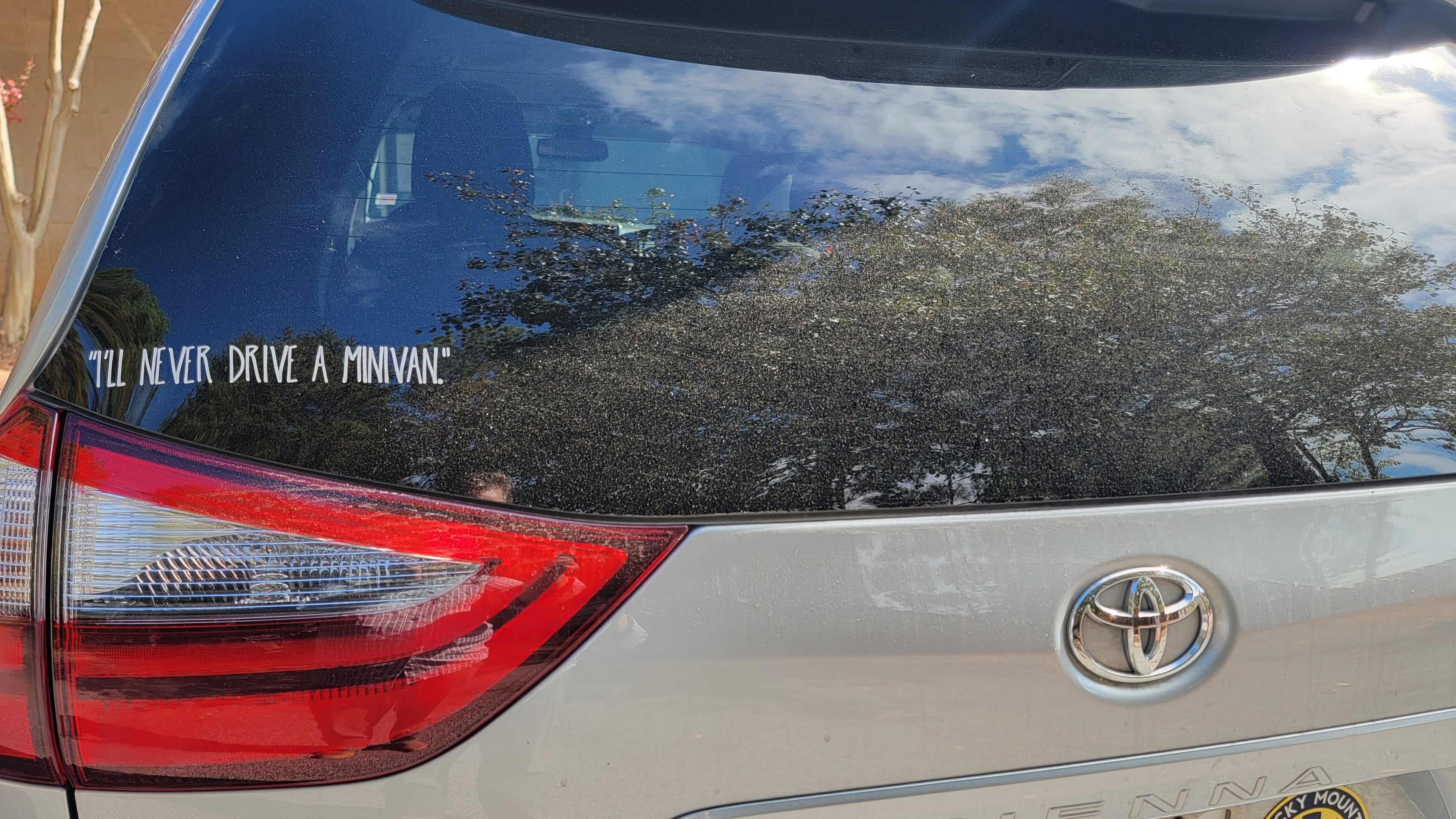 A bumper sticker on a minivan. (Chris Hardesty/Cox Automotive)