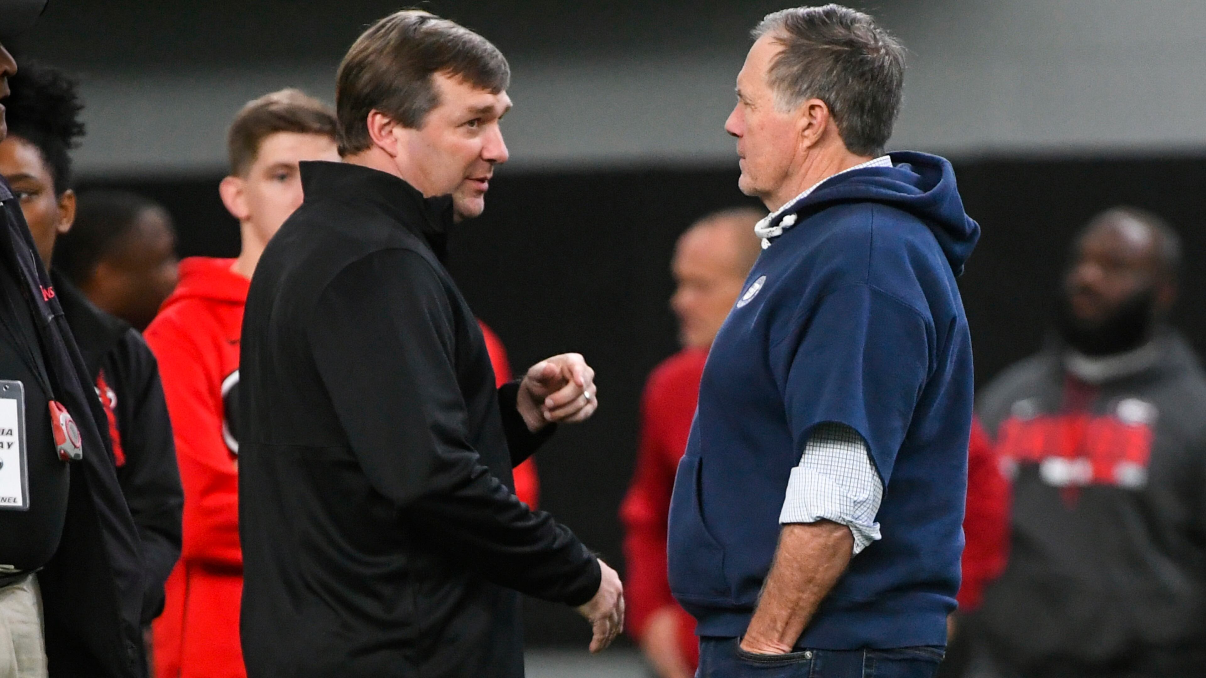 Georgia coach Kirby Smart and New England Patriot coach Bill Belichick (right) chat during Georgia's Pro Day, Wednesday, March 20, 2019, in Athens.