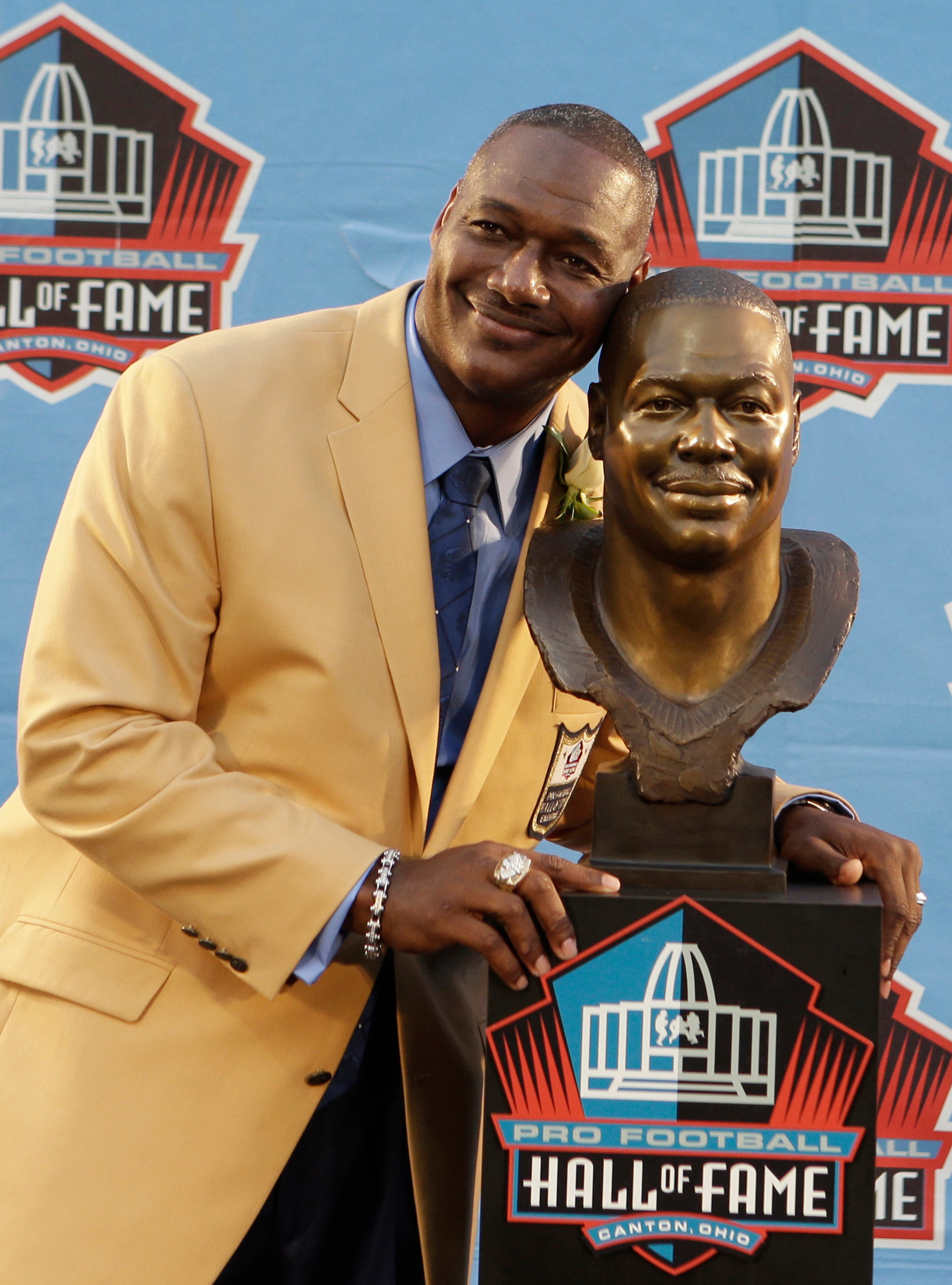Hall of Fame Inductee Derrick Brooks poses with his bust during the 2014 Pro Football Hall of Fame Enshrinement Ceremony at the Pro Football Hall of Fame Saturday, Aug. 2, 2014, in Canton, Ohio. (AP Photo/Tony Dejak)