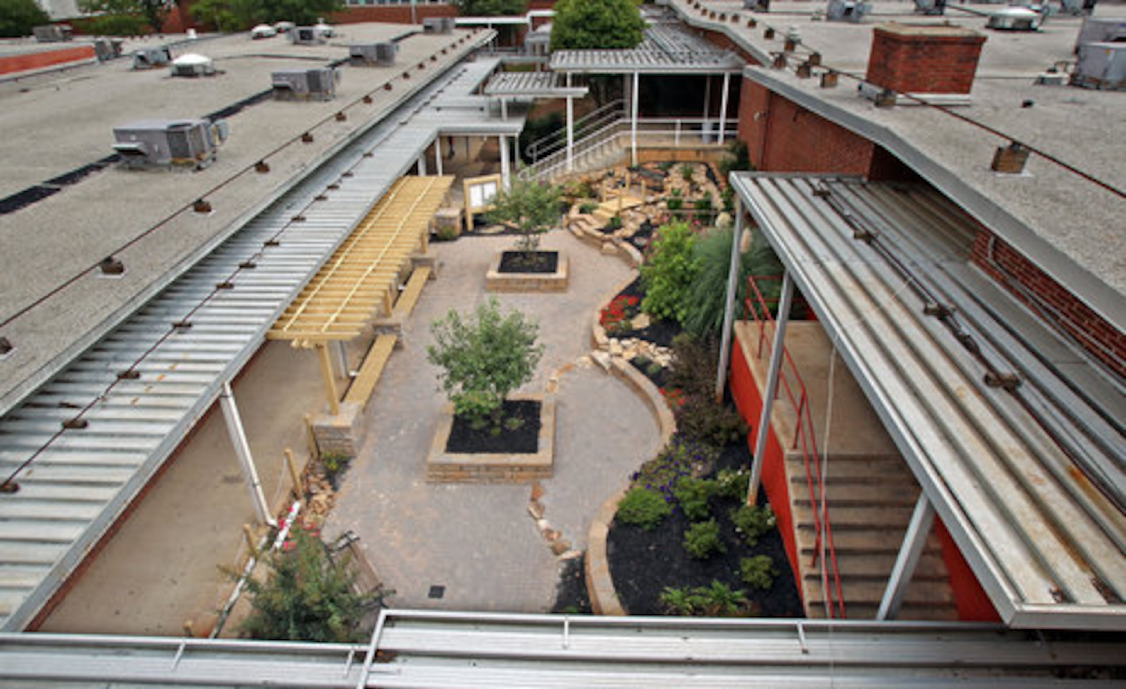 The outdoor learning center provides color and vegetation to a campus made mostly of metal and concrete.
