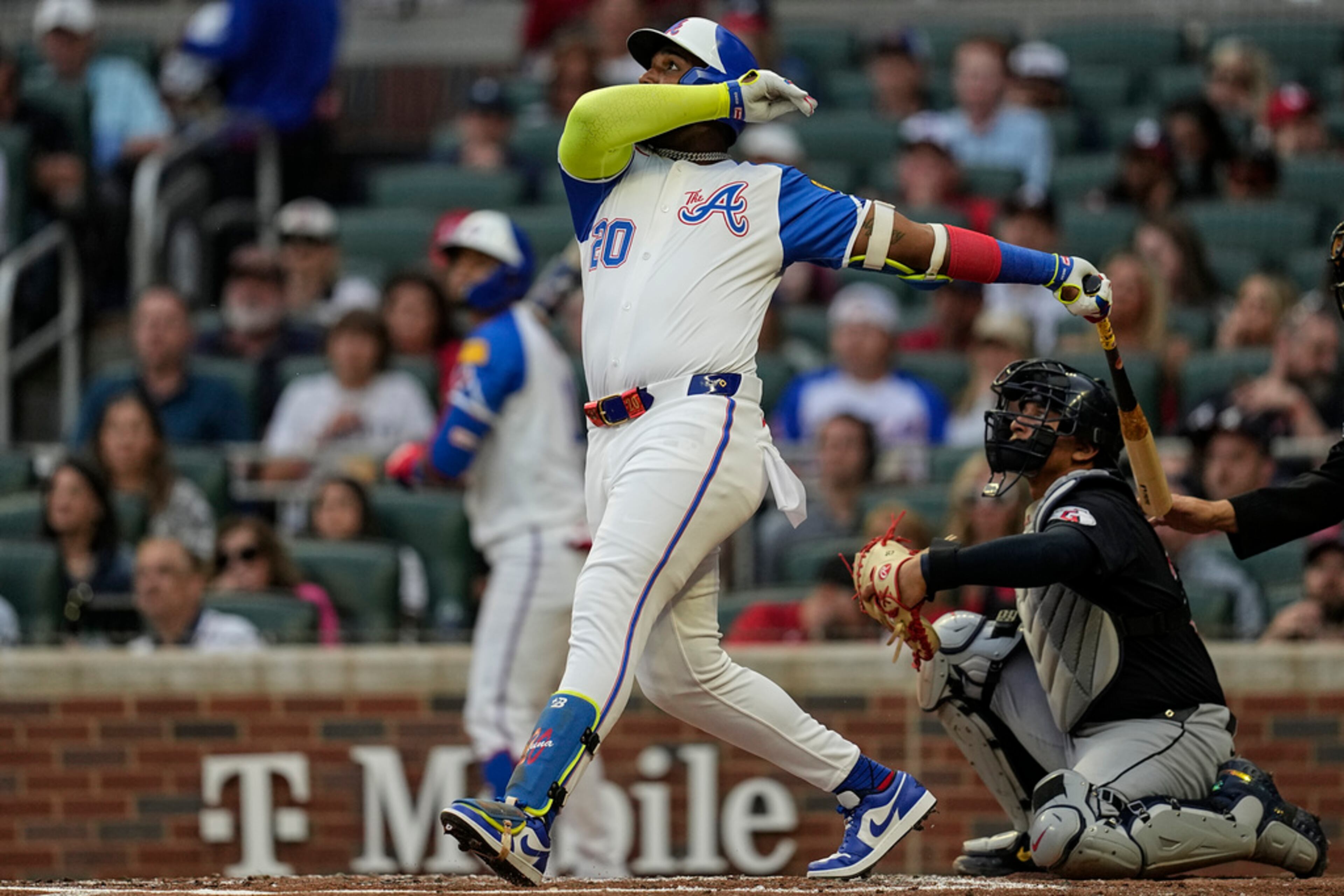 Atlanta Braves designated hitter Marcell Ozuna (20) hits a double against the Cleveland Guardians in the second inning of a baseball game, Saturday, April 27, 2024, in Atlanta. (AP Photo/Mike Stewart)