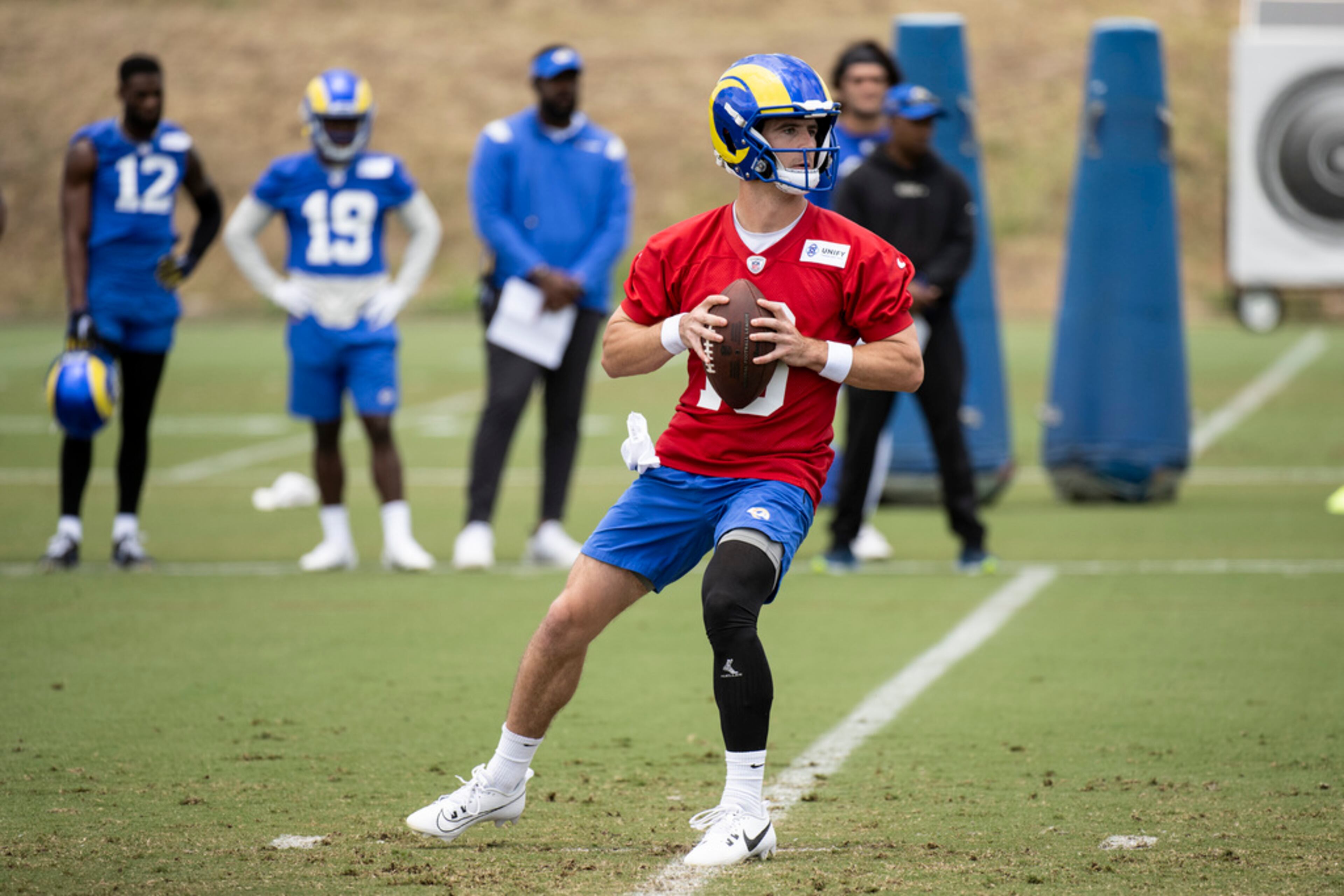 Los Angeles Rams quarterback Stetson Bennett (13) throws a pass during the NFL football team's camp, Tuesday, June 13, 2023, in Thousand Oaks, Calif. (AP Photo/Kyusung Gong)