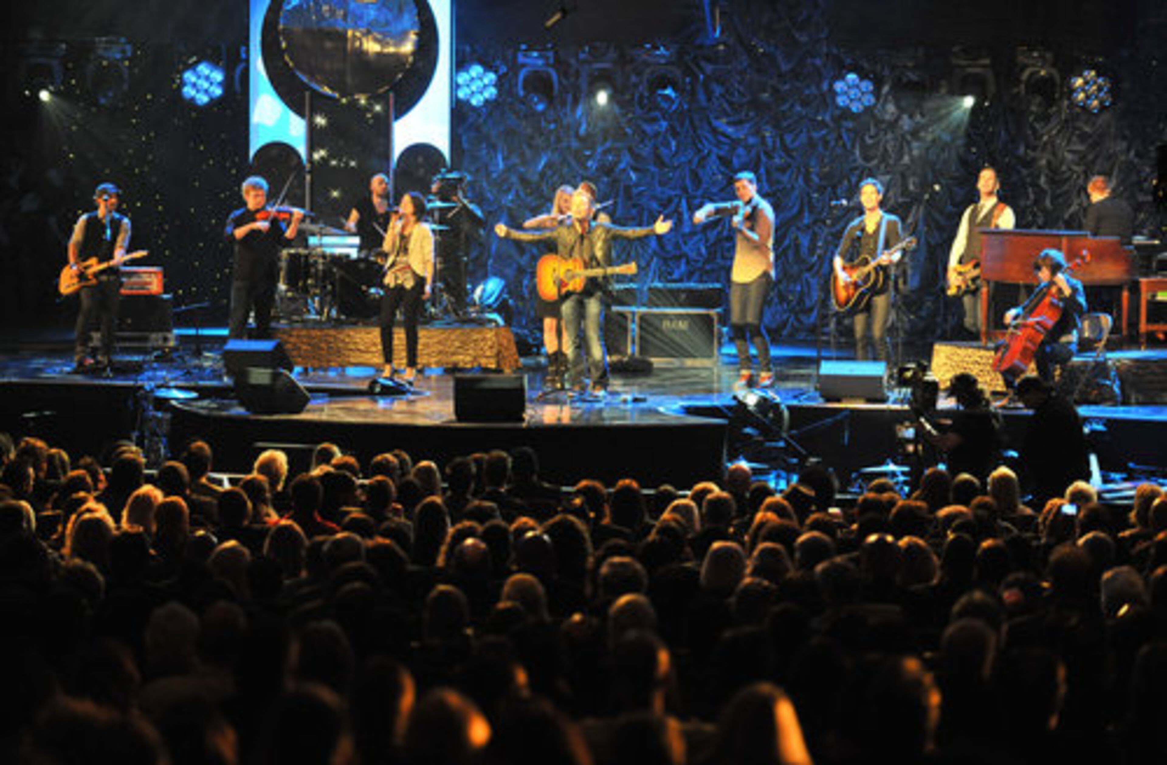 Chris Tomlin (center) opens the stage with his intro performance during the 42nd Annual Dove Awards, honoring the past year's best in gospel music.