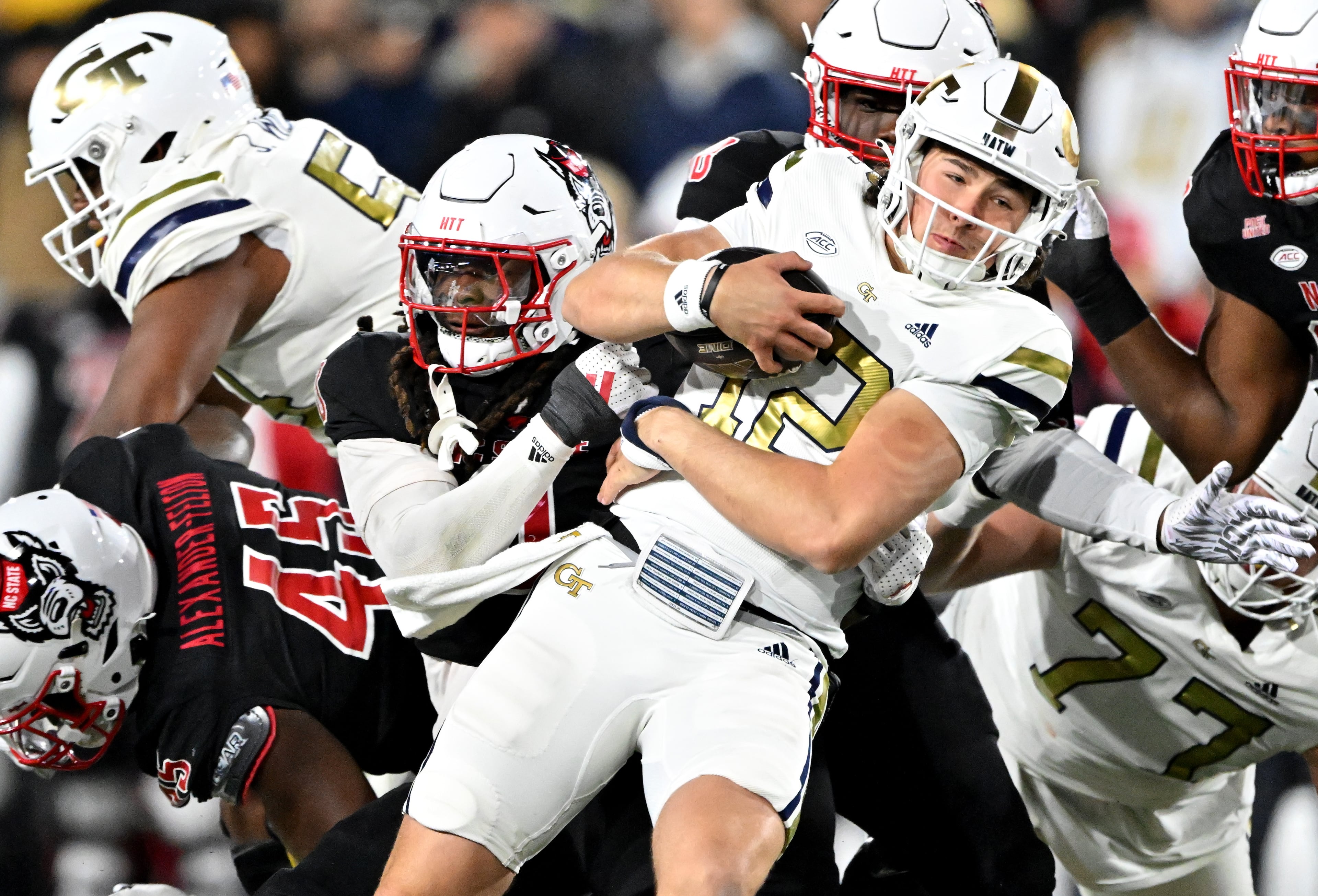 Georgia Tech quarterback Aaron Philo (12) pushes for a first down during the first half of an NCAA college football game at Georgia Tech's Bobby Dodd Stadium, Thursday, November 21, 2024, in Atlanta. (Hyosub Shin / AJC)